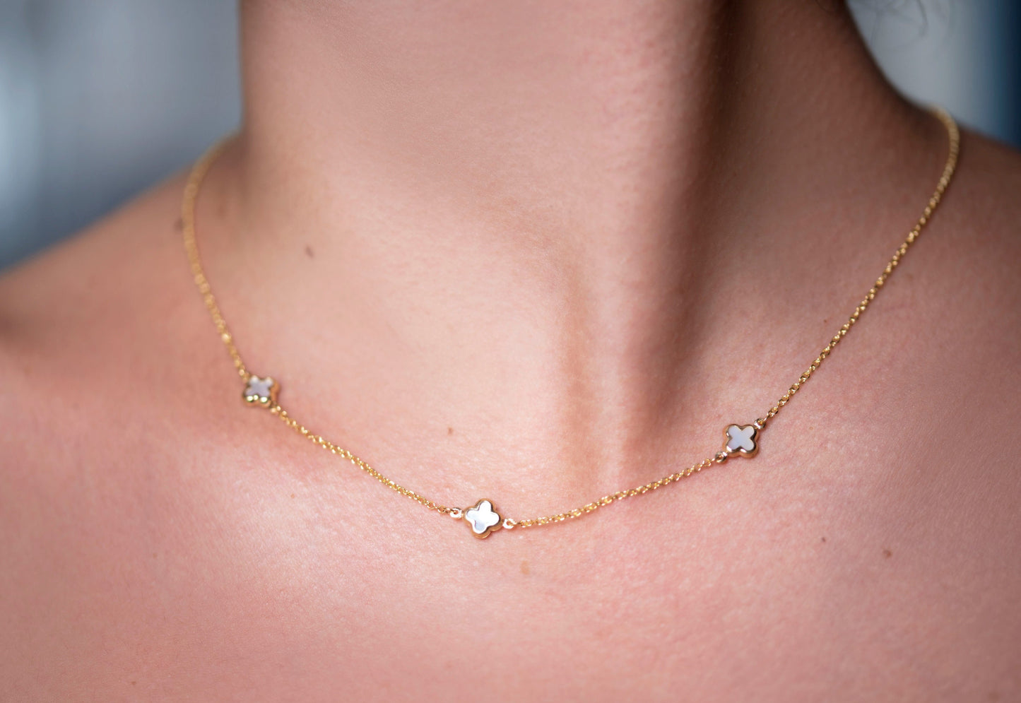 Elegant Four Leaf Clover Necklace featuring three mother-of-pearl motifs set in 14k gold.