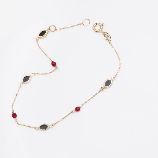 a 14k gold station bracelet with onyx and tourmaline for women 