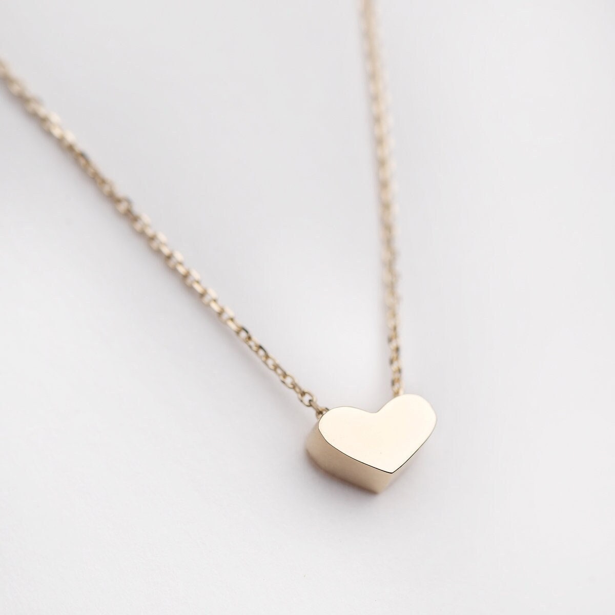 dainty heart necklace in 14k yellow gold