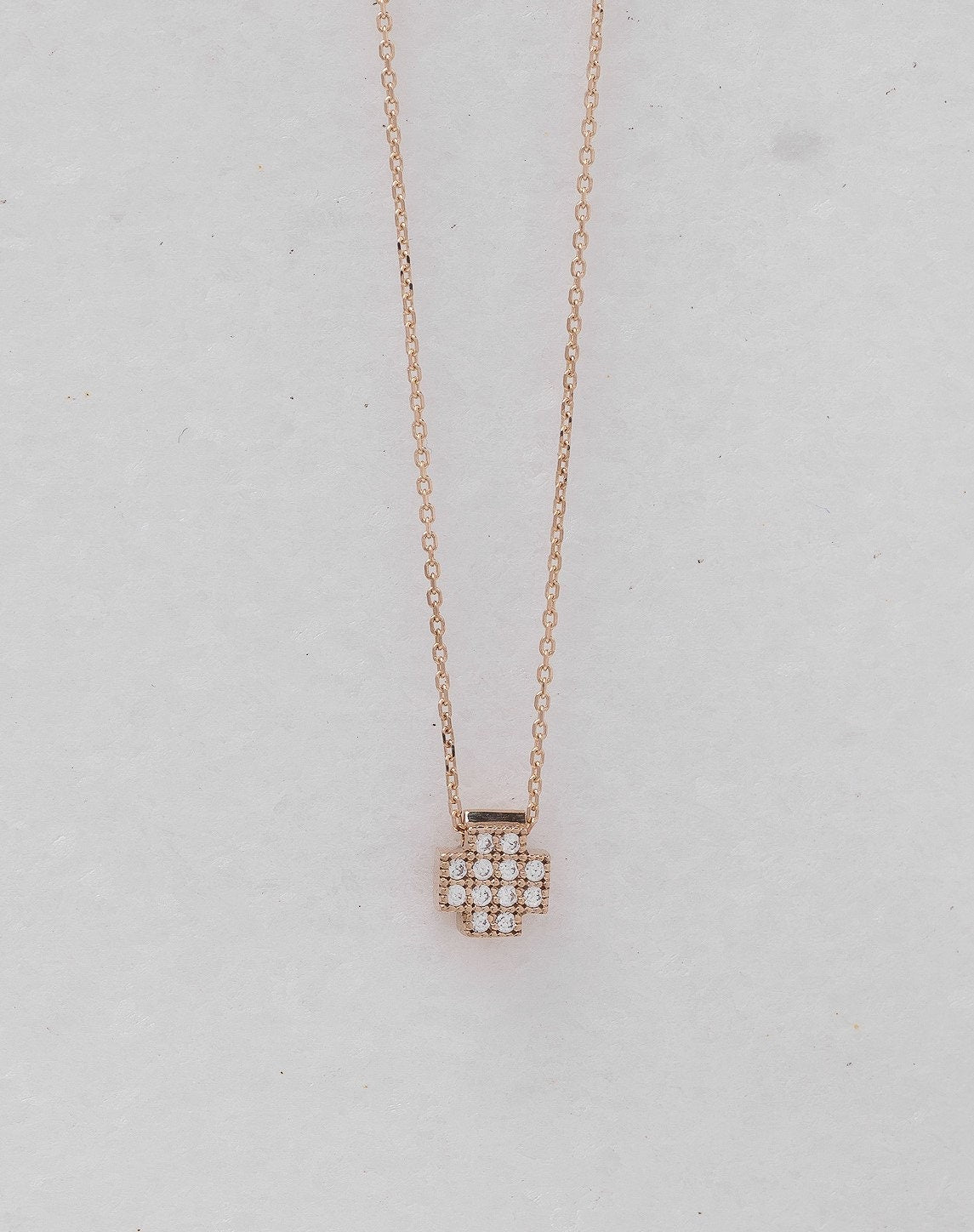 square cross necklace in 14k gold paved with white cubic zirconia stones for women 