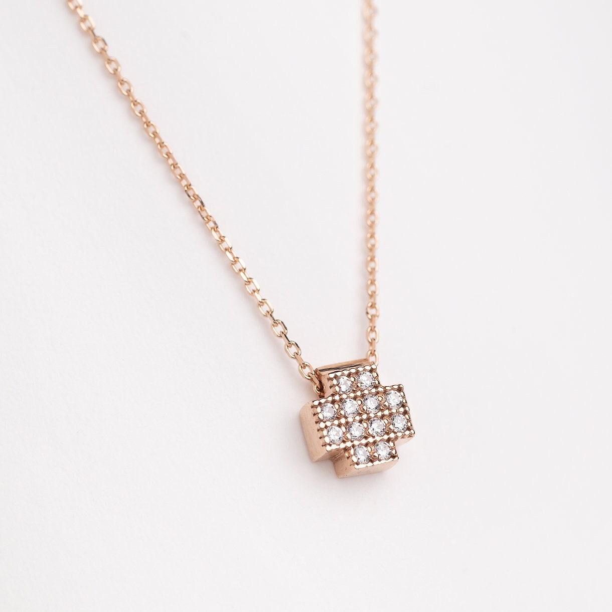 square cross necklace in 14k gold paved with white cubic zirconia stones for women 