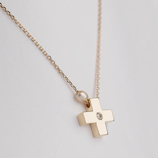 small diamond cross necklace with a small pearl in 14k yellow gold for women 