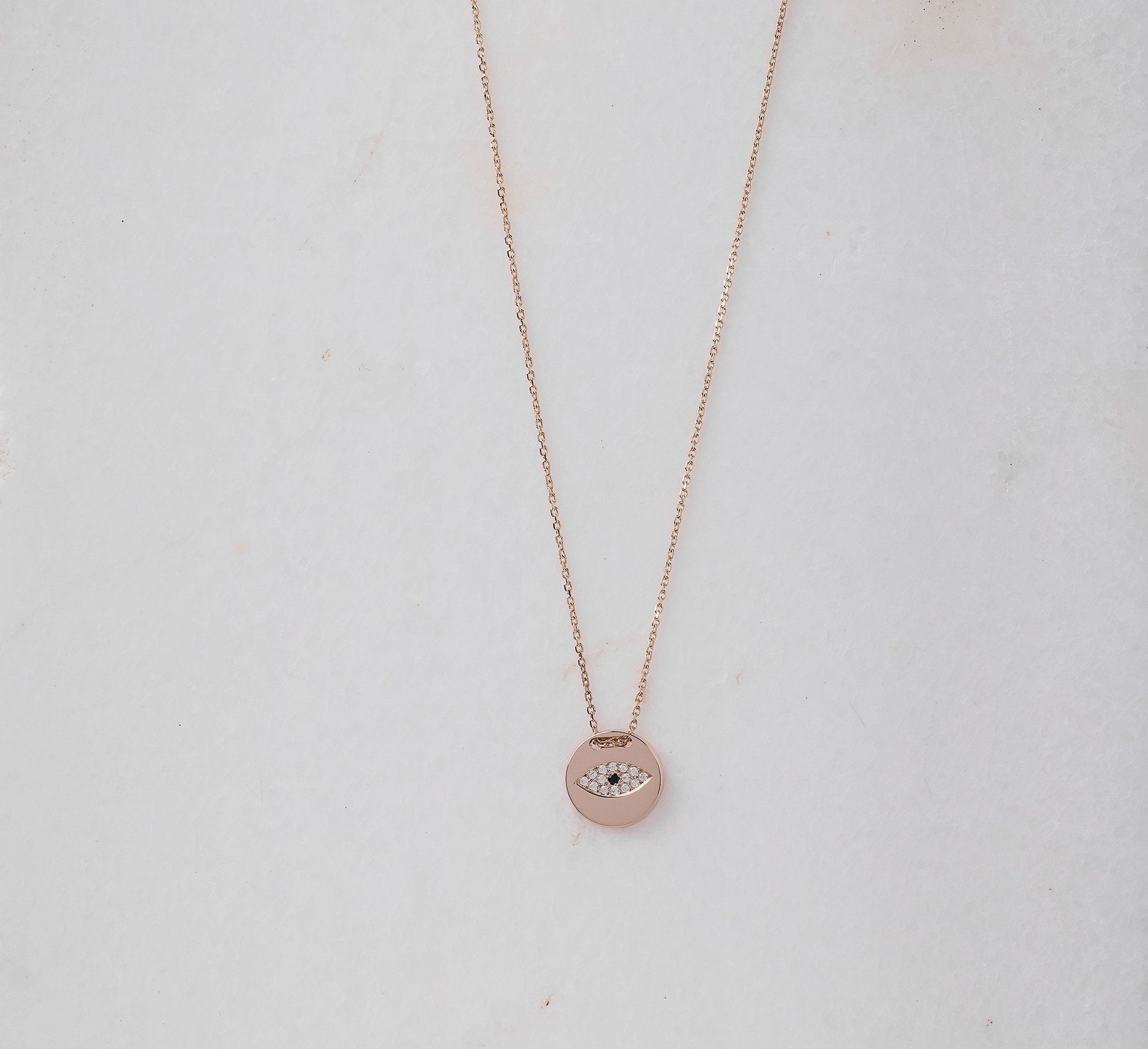 Pavé evil eye necklace in 14k yellow gold for women.