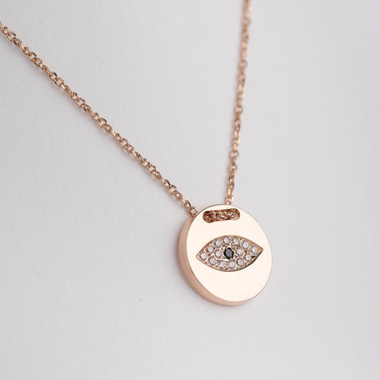 Pavé evil eye necklace in 14k yellow gold for women.