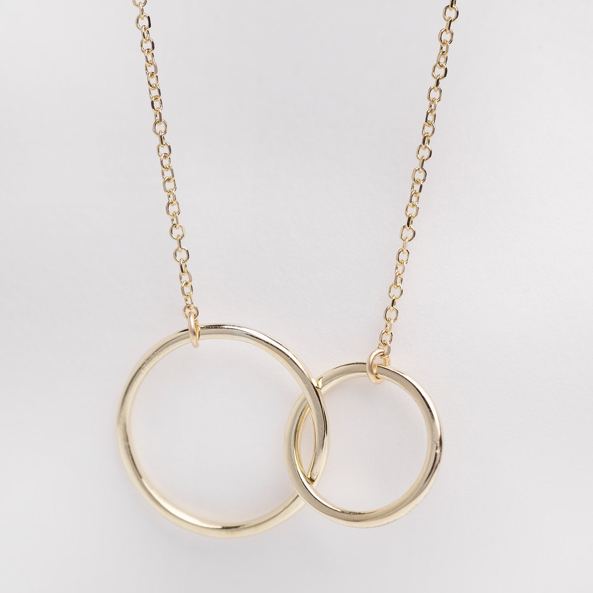 14k gold necklace with two interlocking circles 