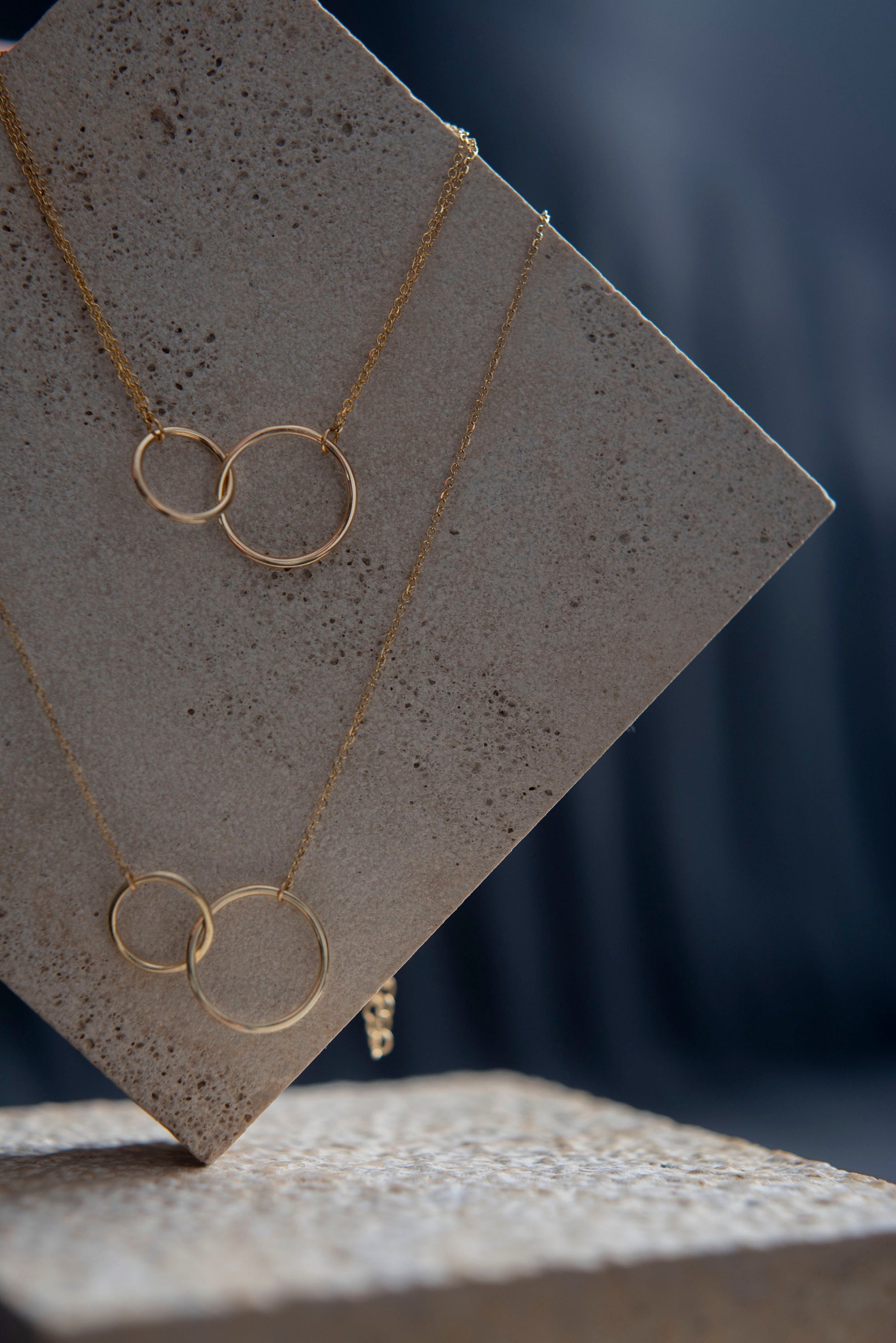 14k gold necklace and bracelet with two interlocking circles 