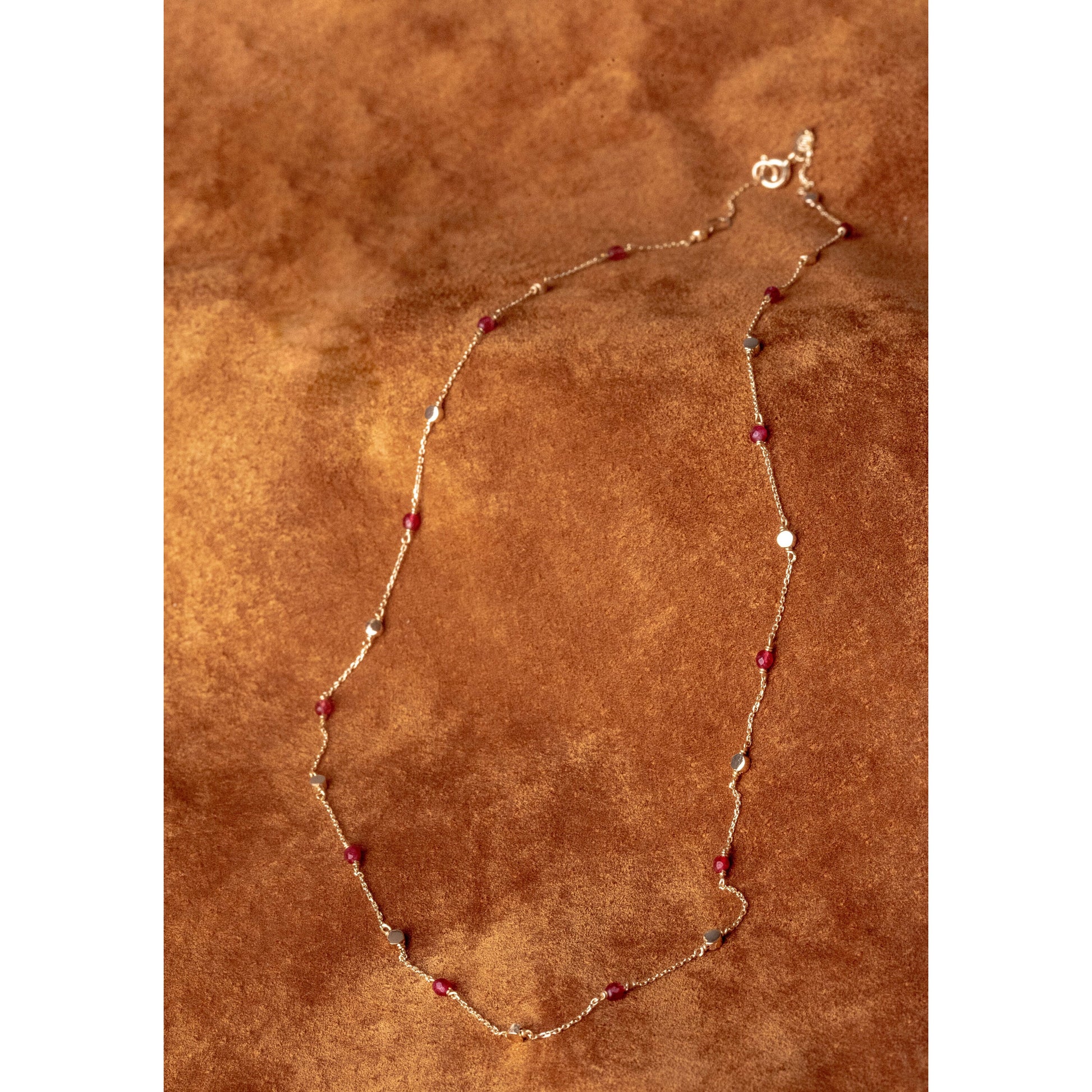 Station necklace featuring gold beads and tourmaline stones set in 14k gold.