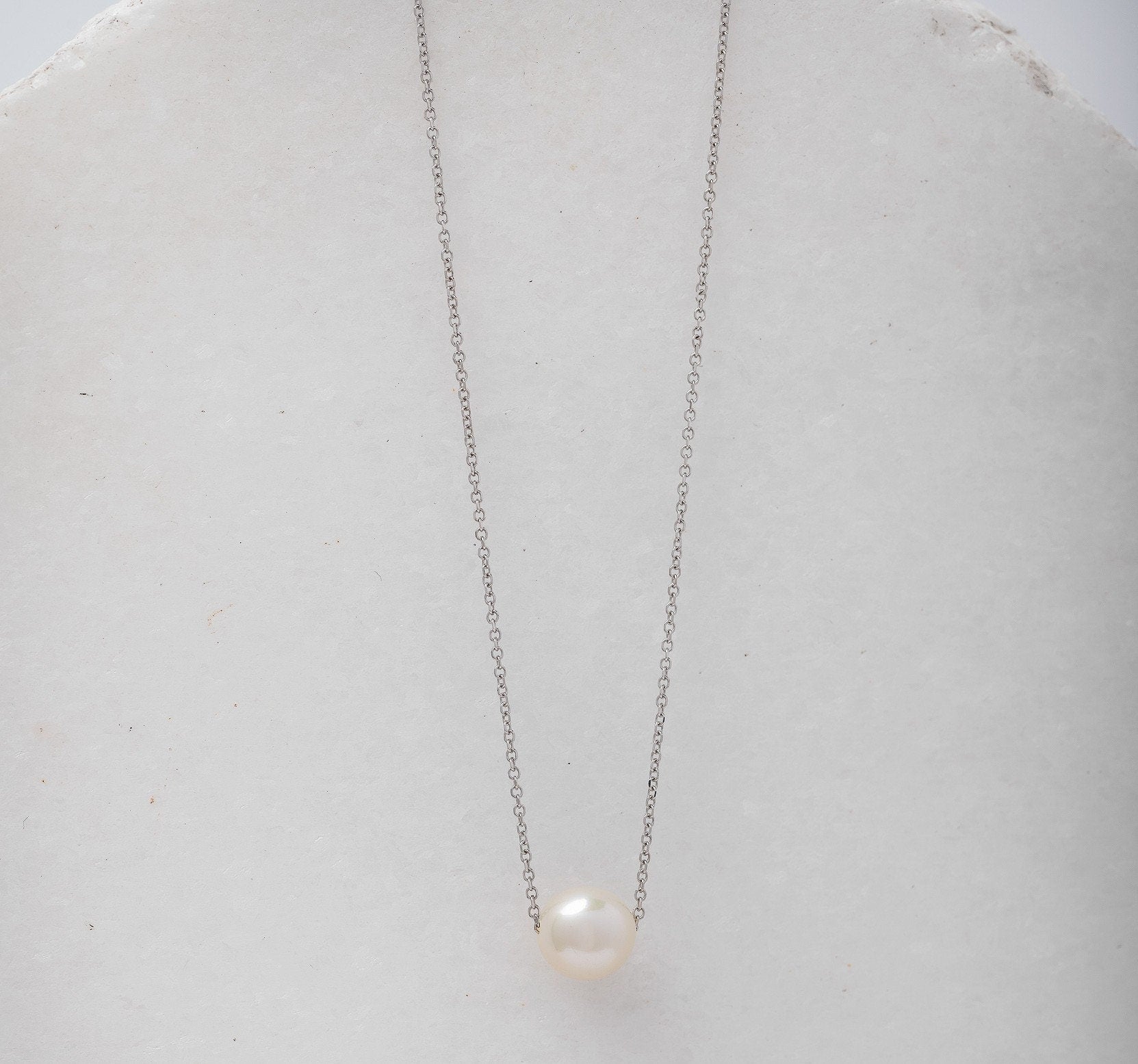 Pearl Necklace Floating in 14k White Gold