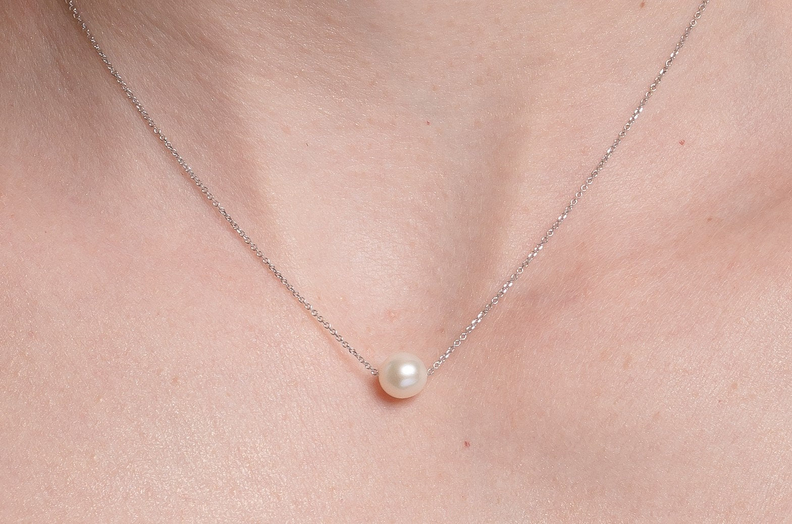 Pearl Necklace Floating in 14k White Gold