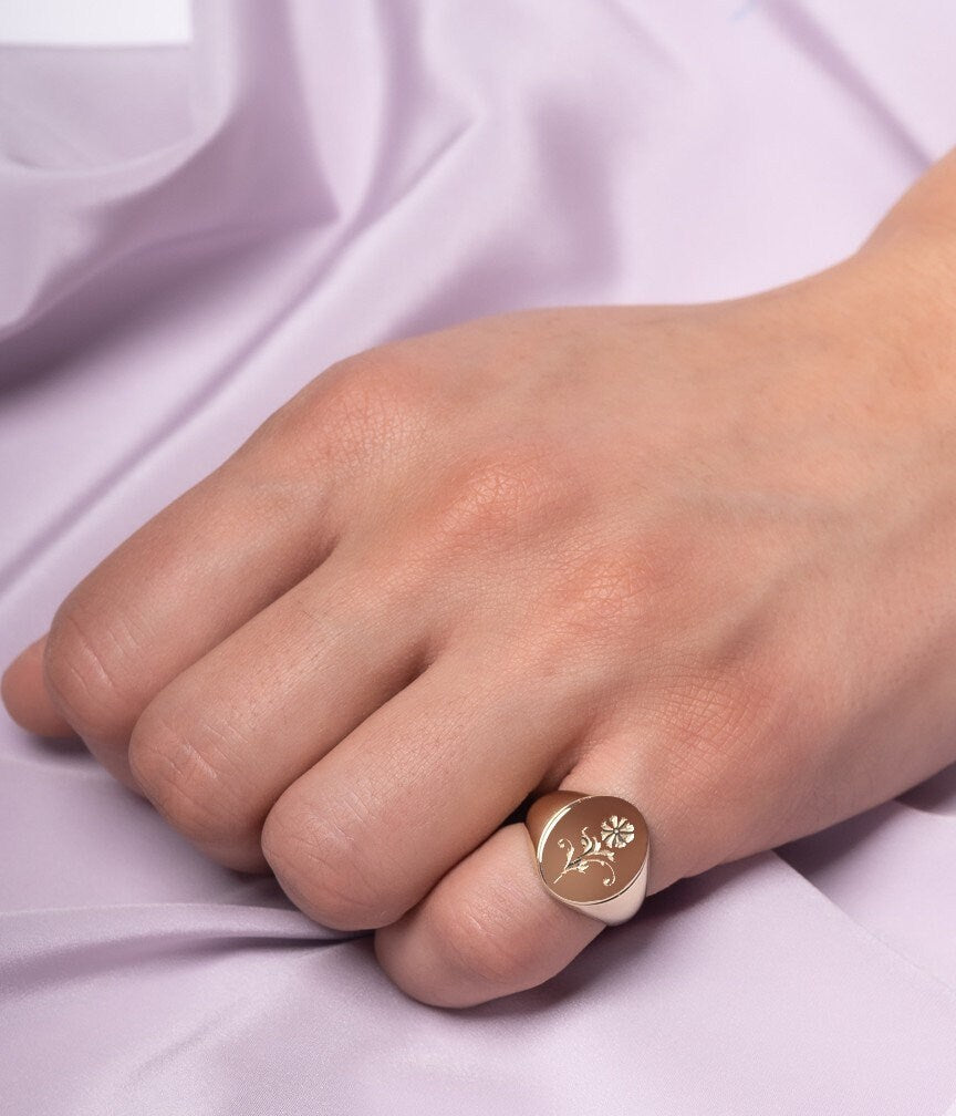 Women's Flower Signet Ring in 14K Gold worn by a model on pinky finger