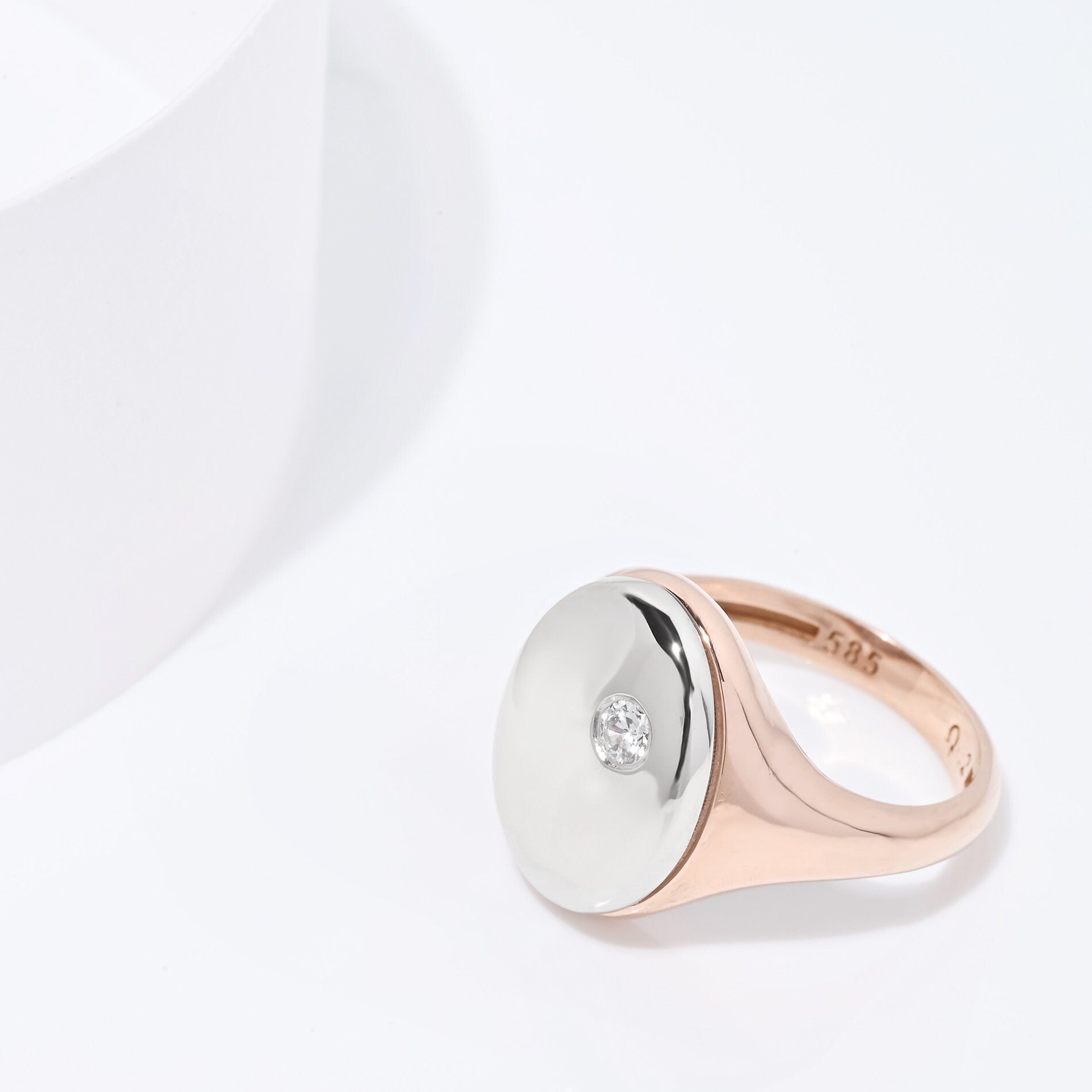 Oval diamond signet rings in 14k yellow gold for women.