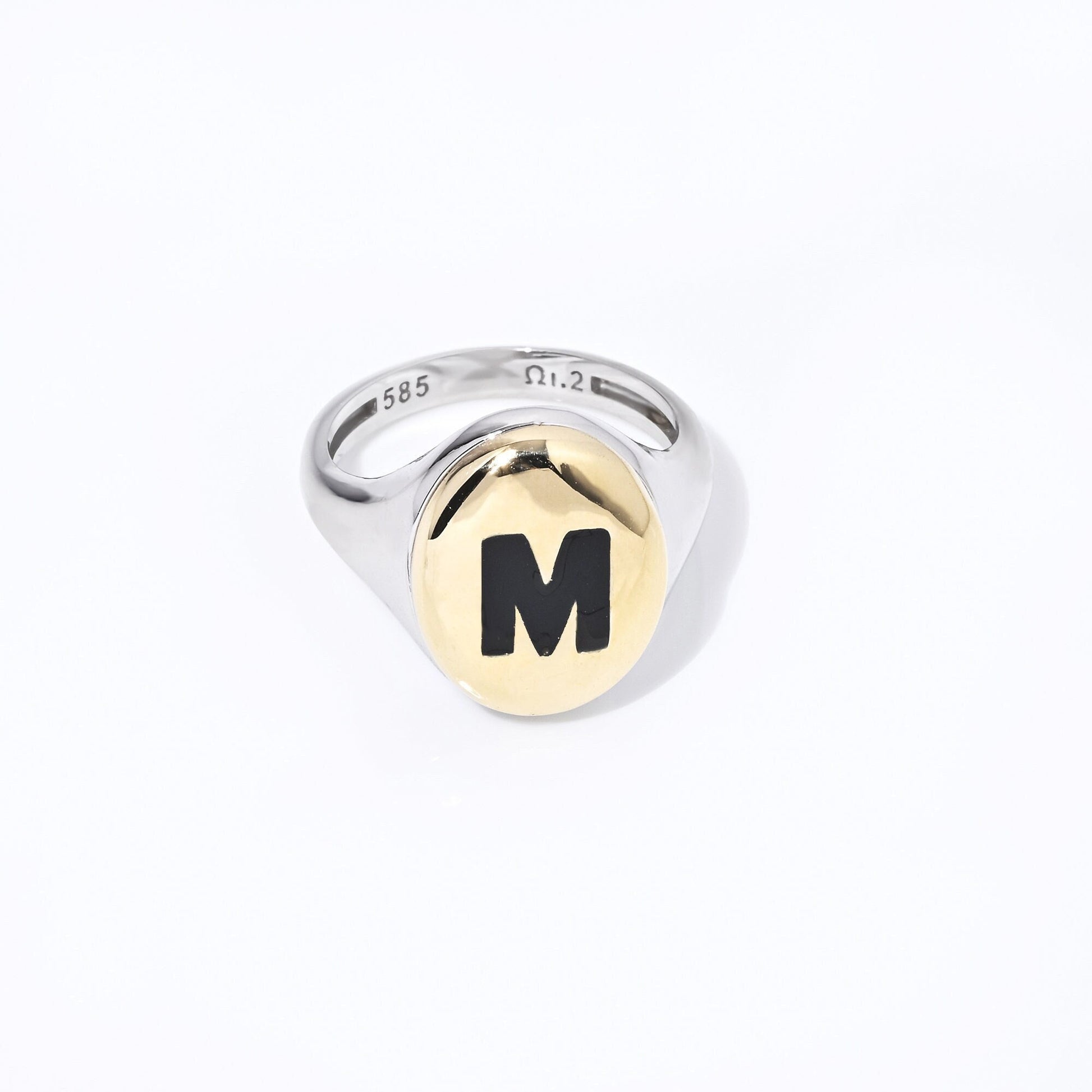 A two-tone monogram signet ring in 14k gold with enamel accents for women.