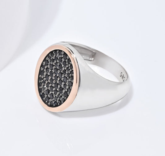 A two-tone signet ring for women, adorned with black cubic zirconia stones and set in 14k gold.