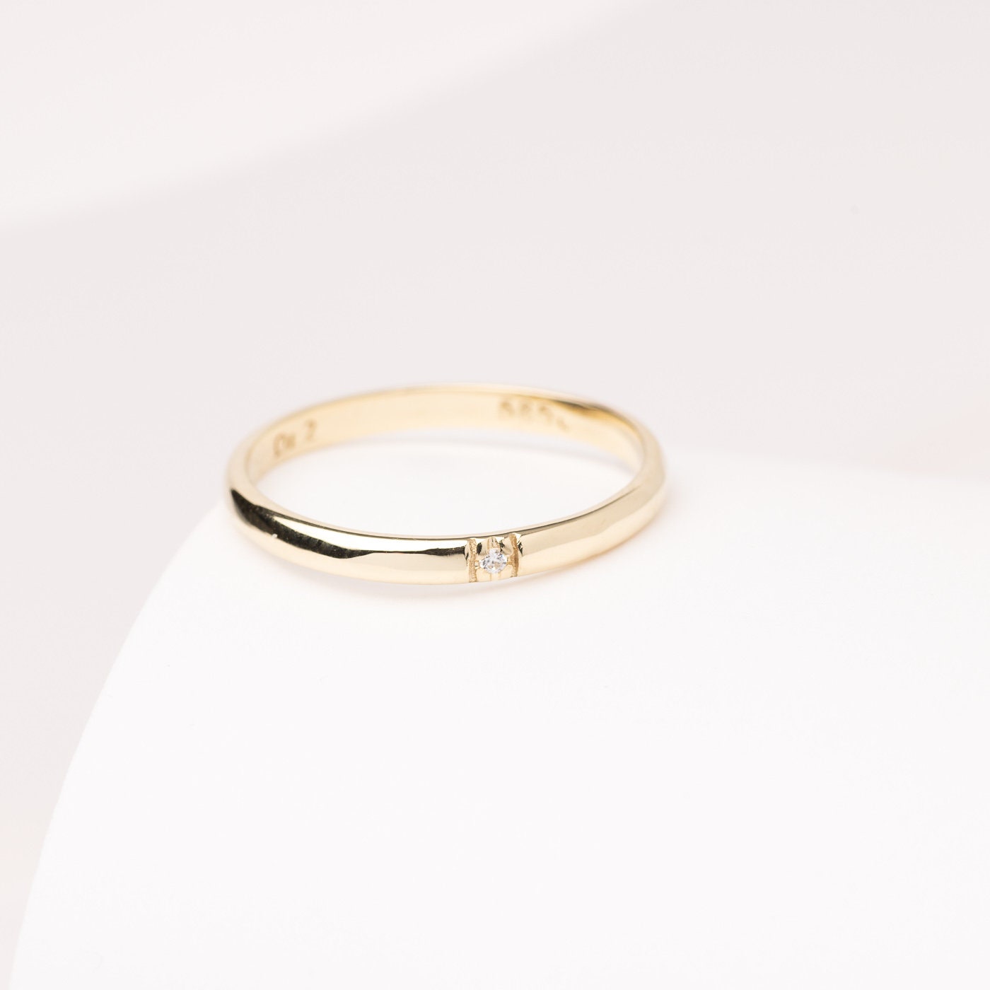 A minimalist diamond band ring crafted in 14k solid gold for women.