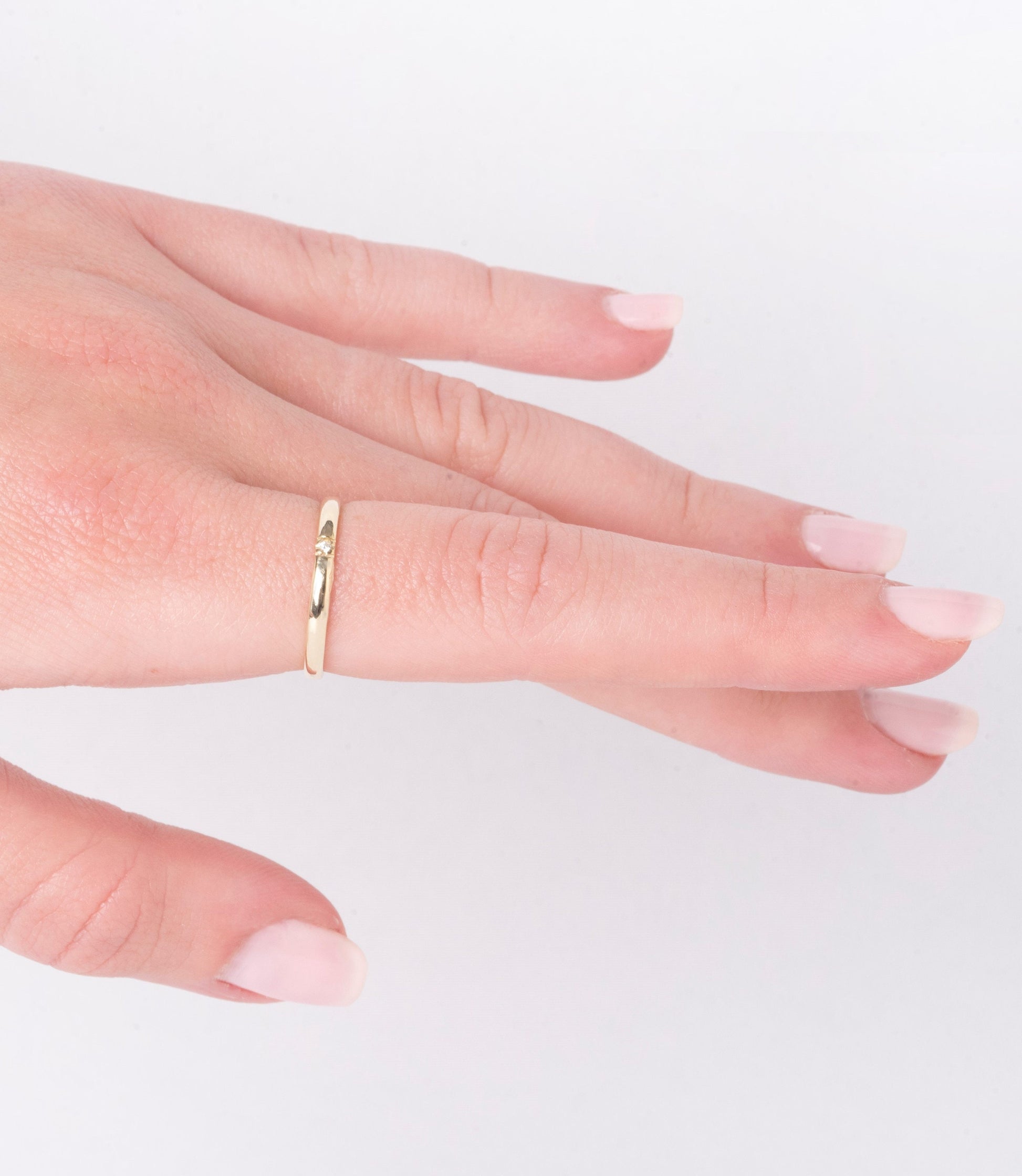 A minimalist diamond band ring crafted in 14k solid gold for women.