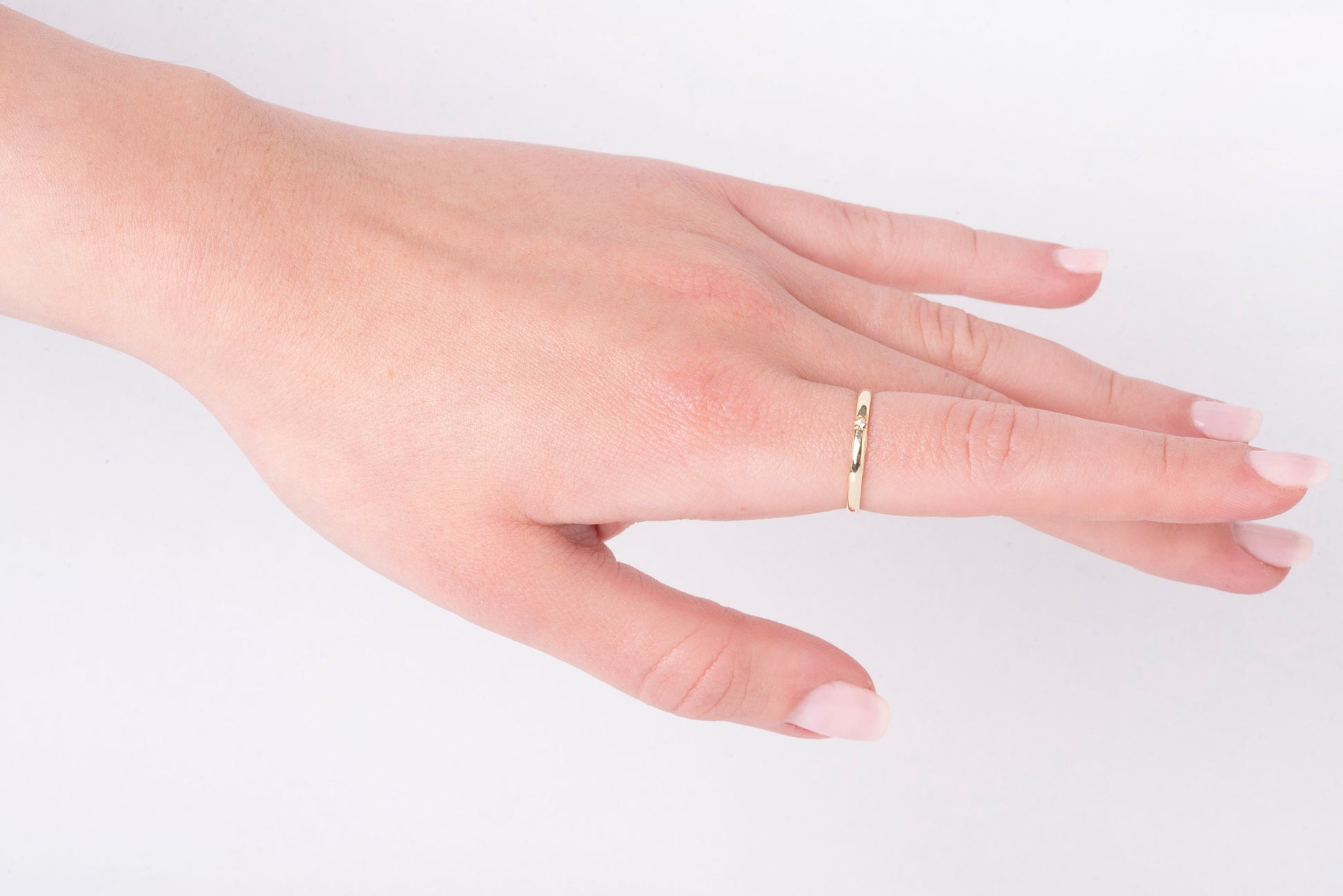 A minimalist diamond band ring crafted in 14k solid gold for women.