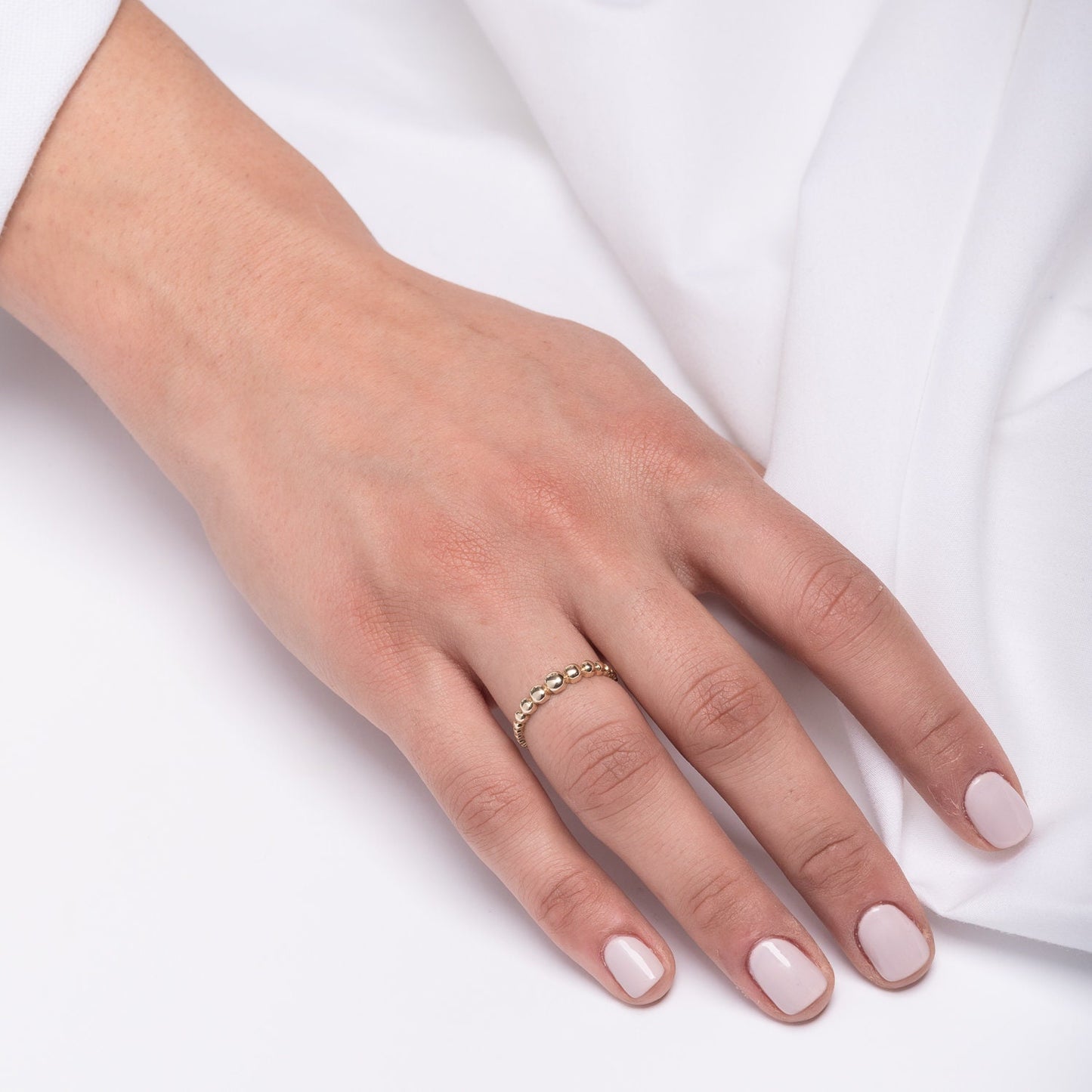 A beaded ring crafted from 14k solid gold for women.