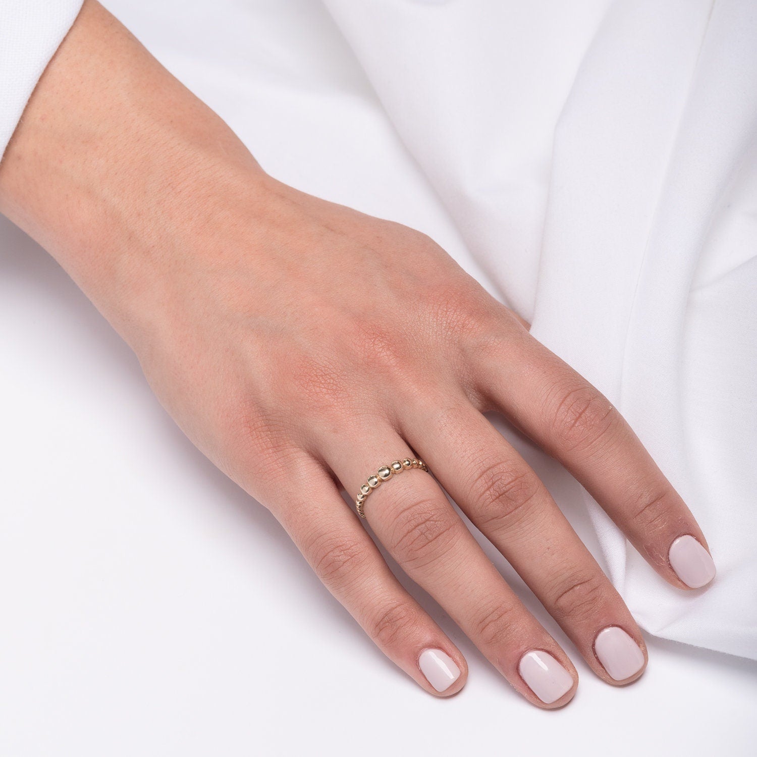 A beaded ring crafted from 14k solid gold for women.