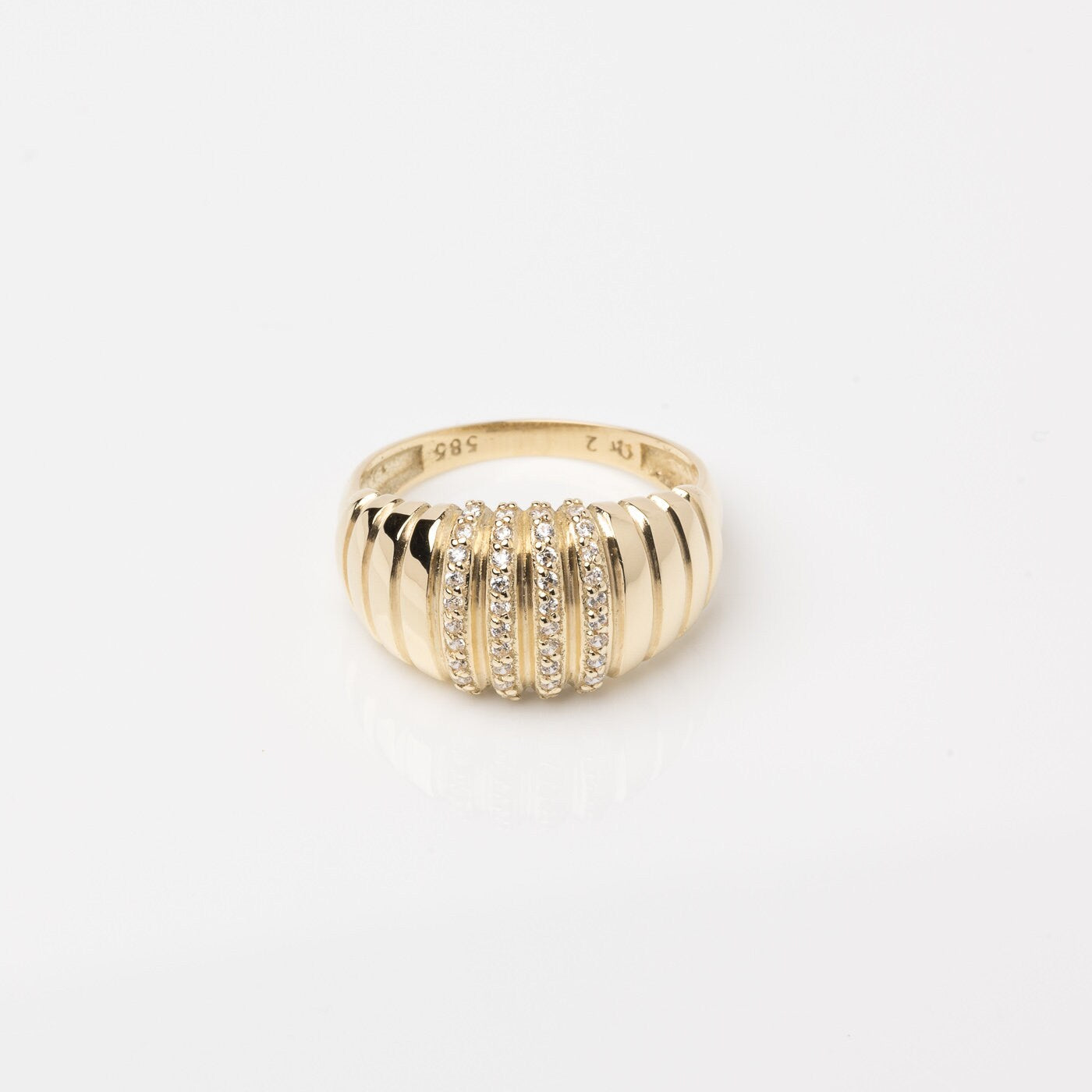 A Croissant Ring adorned with white cubic zirconia stones, set in 14k gold for women.