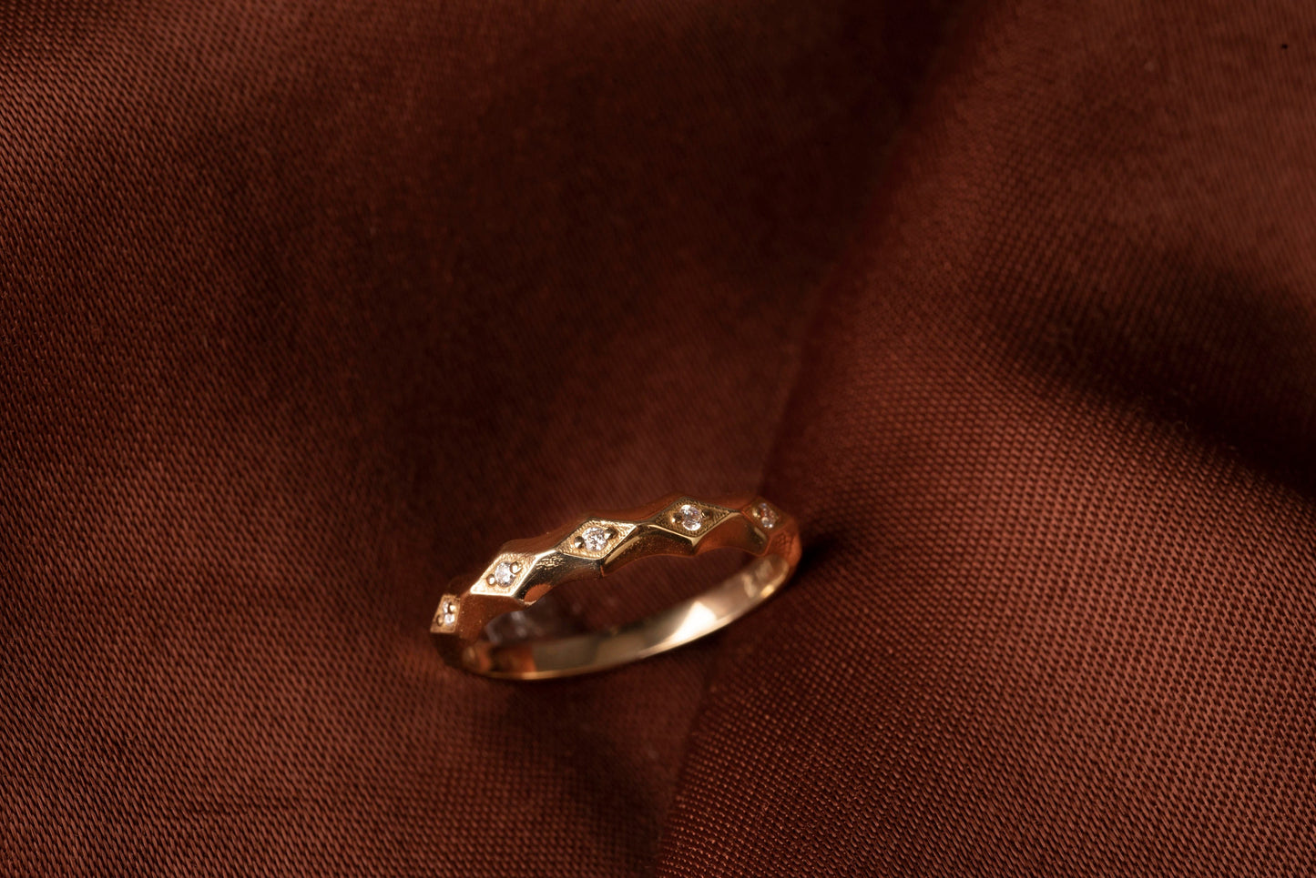 Handcrafted 14k gold ring adorned with white cubic zirconia stones, designed for women.