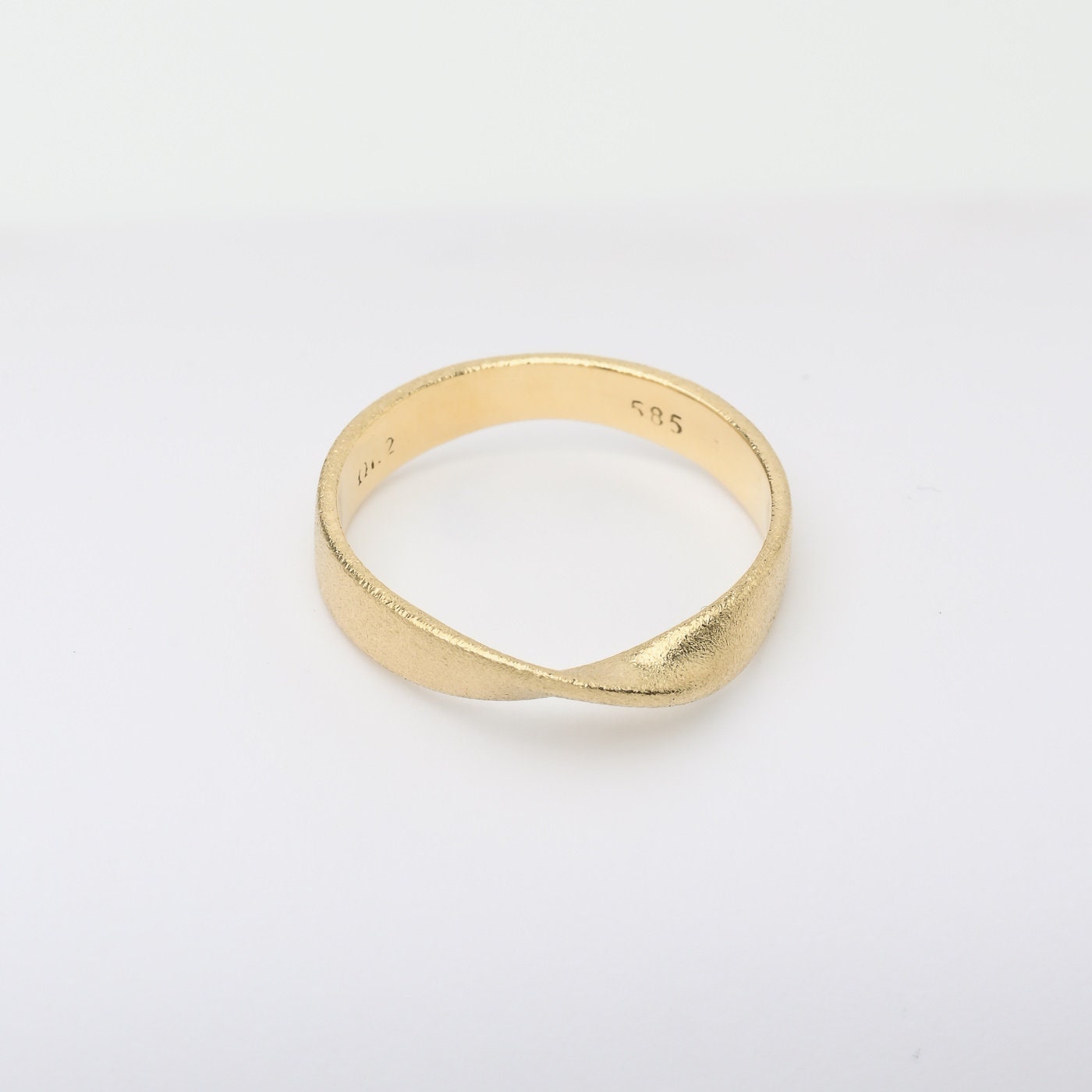 Sandblasted Möbius Ring in 14k solid gold for women.