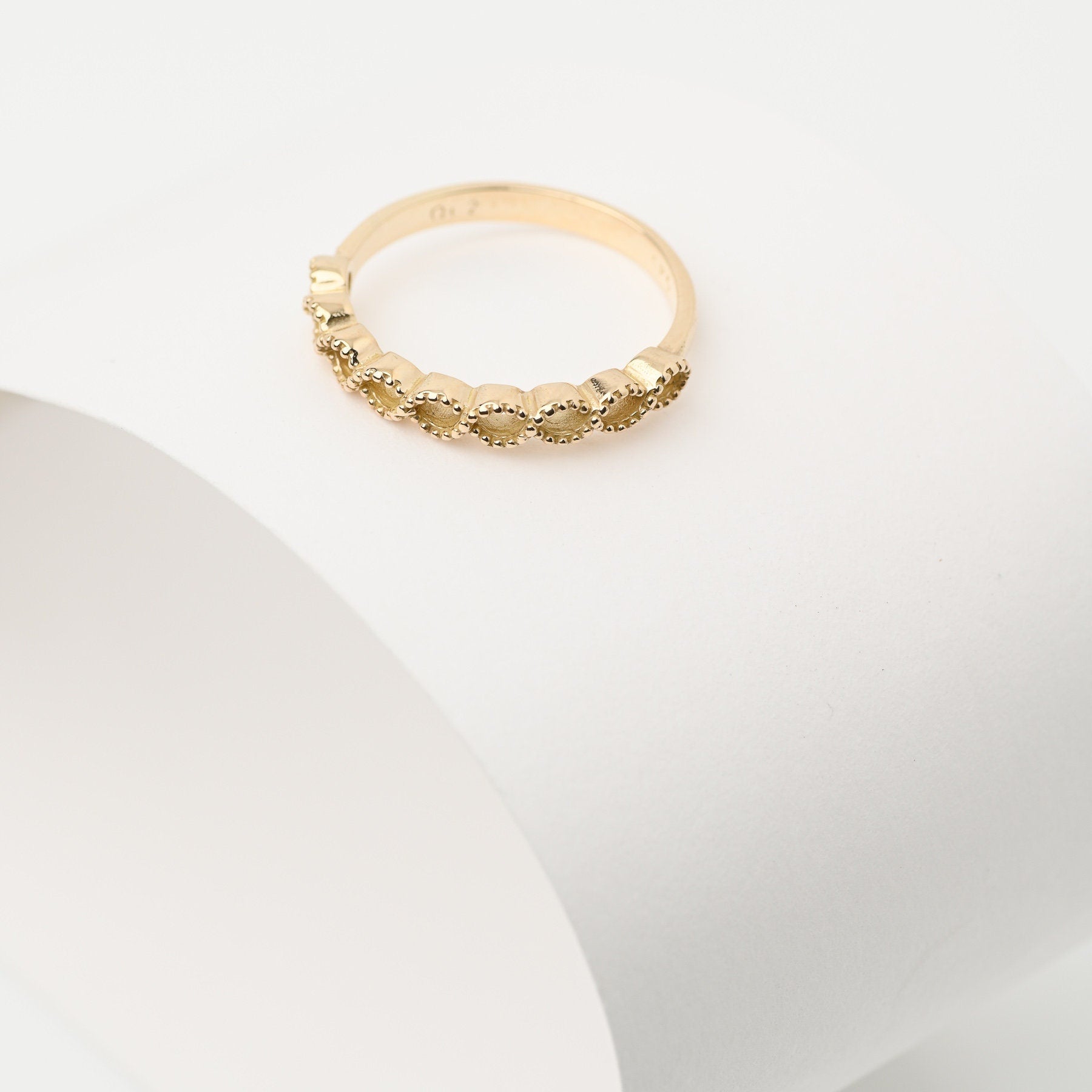 Handcrafted 14k solid gold ring featuring openings on the upper section.