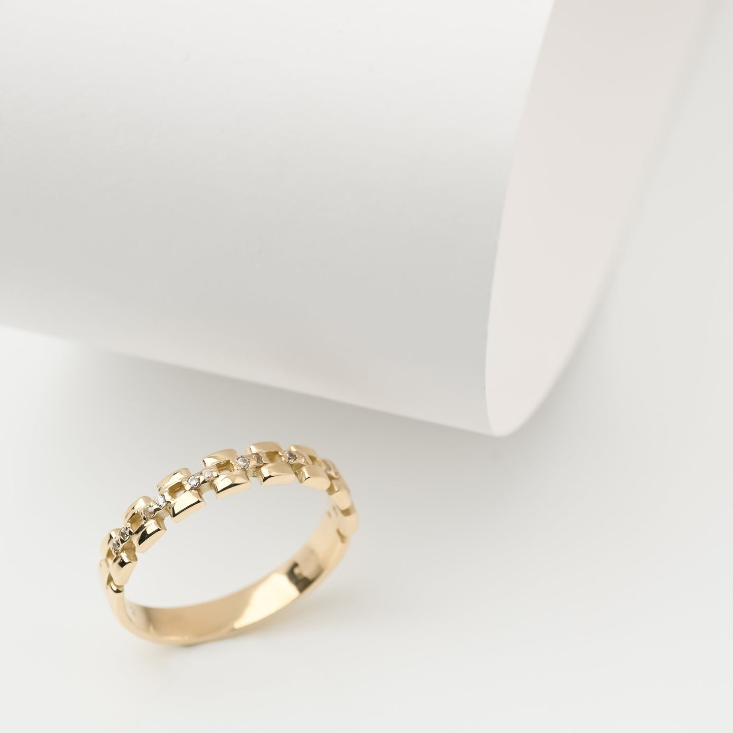 Handcrafted Cuban Link Chain Ring in 14k gold, adorned with white cubic zirconia stones, designed for women.