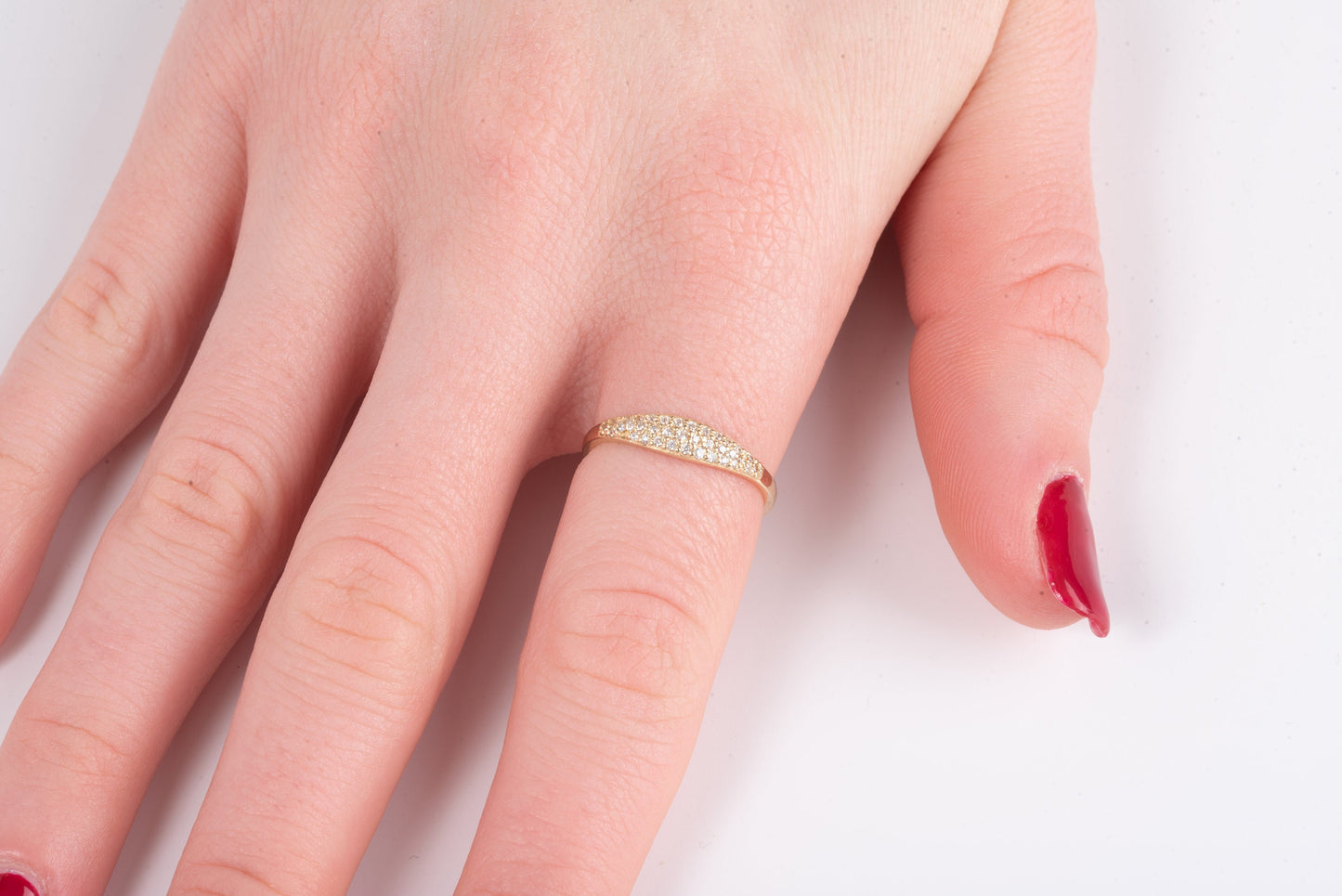 Handcrafted 14k solid gold ring set with white cubic zirconia stones, designed for women.