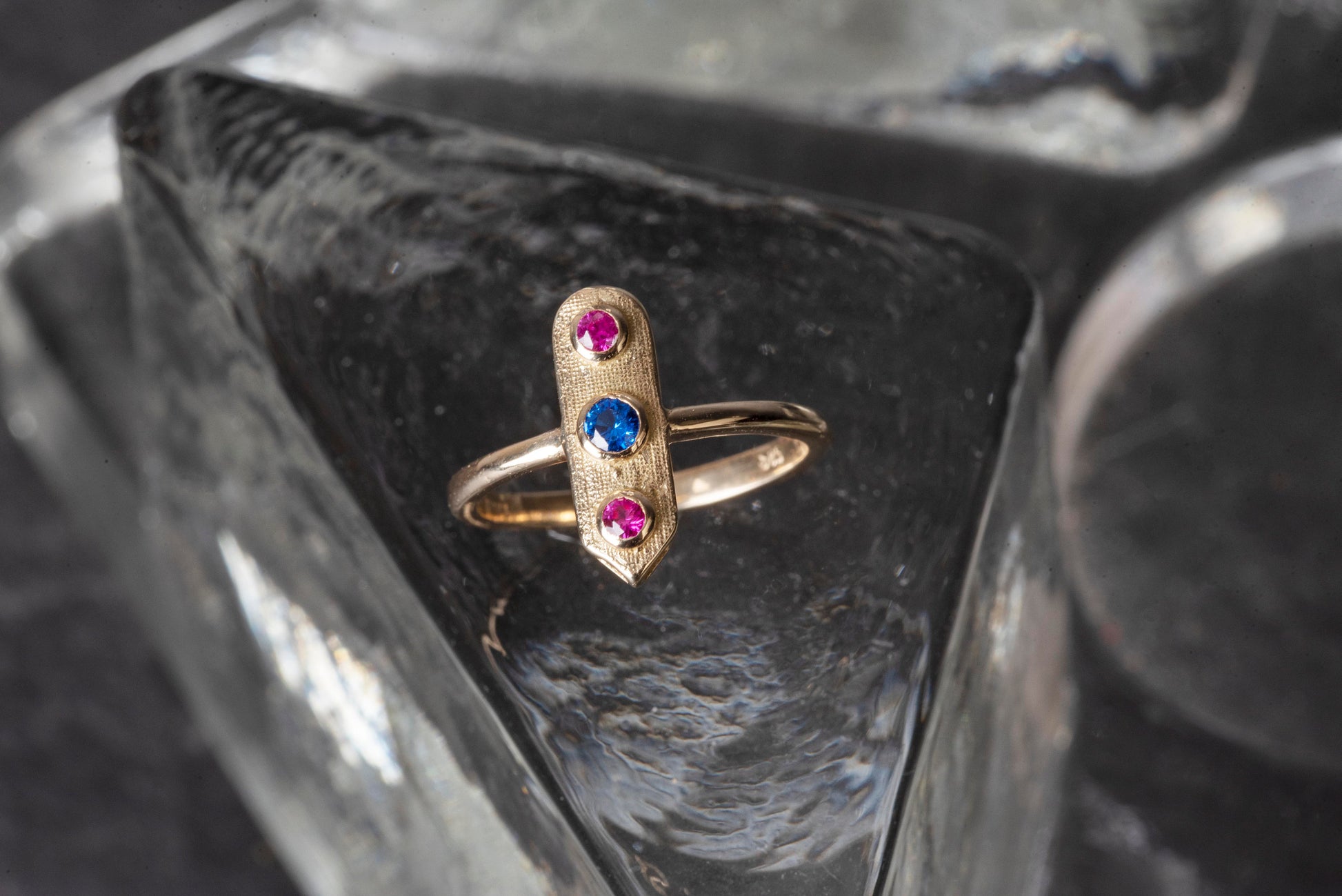 Handcrafted arrow-shaped gold ring with three gemstones set in 14k solid gold.