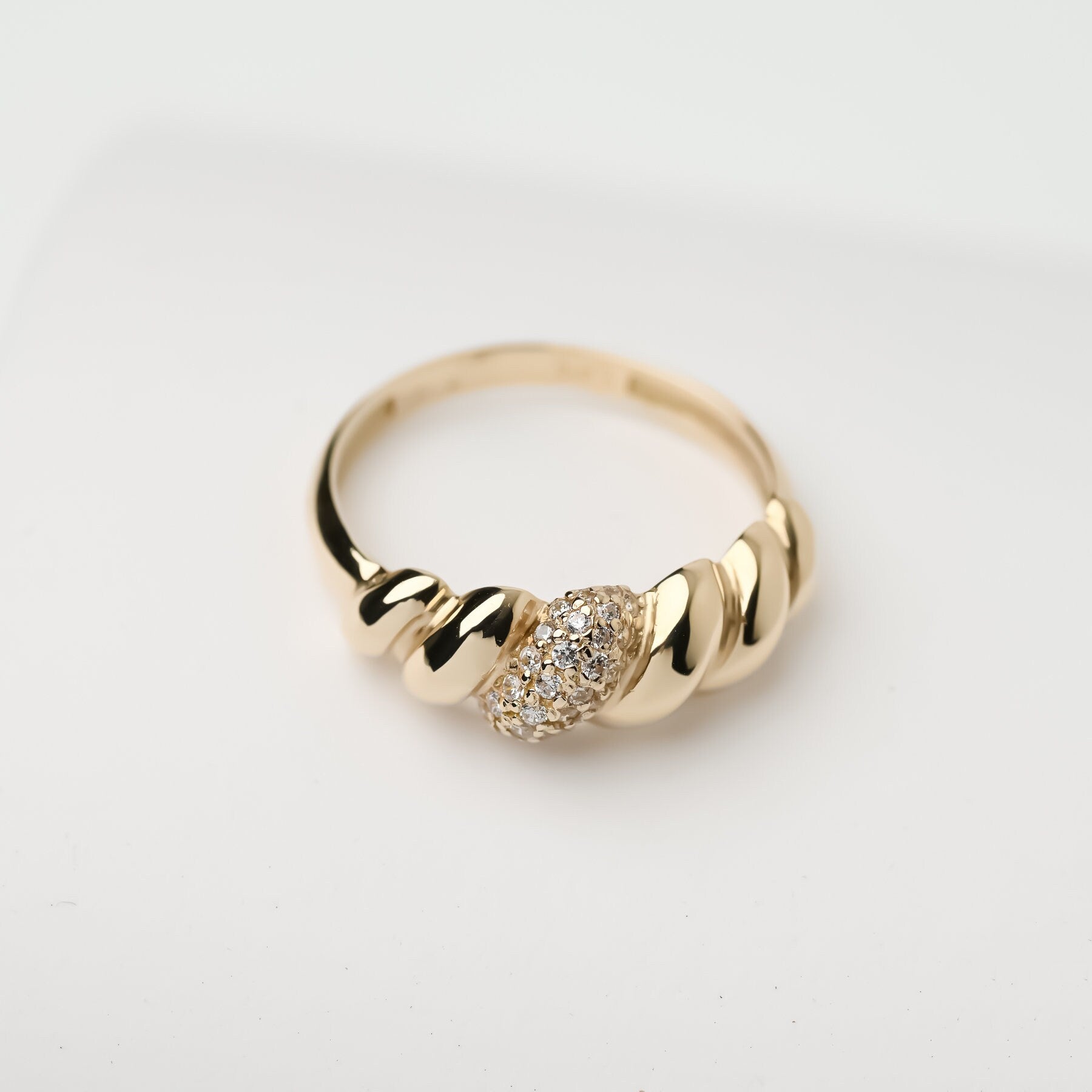 Handmade Croissant Ring in 14k gold, partially paved with white cubic zirconia stones.