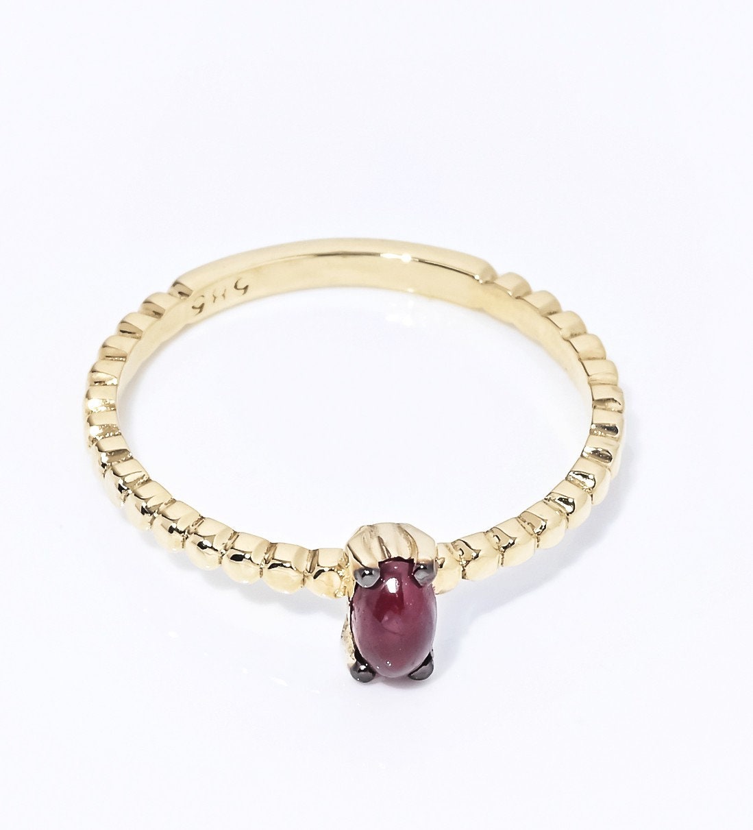 Handmade 14K gold ring with ruby beads for women, set in prongs.