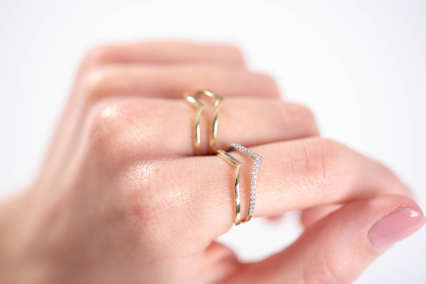 Two double chevron rings in 14k gold.