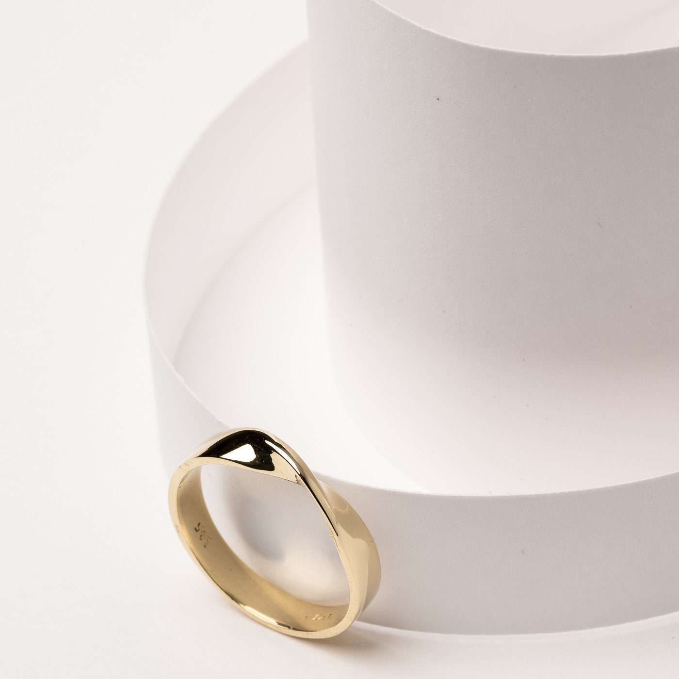 Thick Möbius ring in 14k solid gold for women.