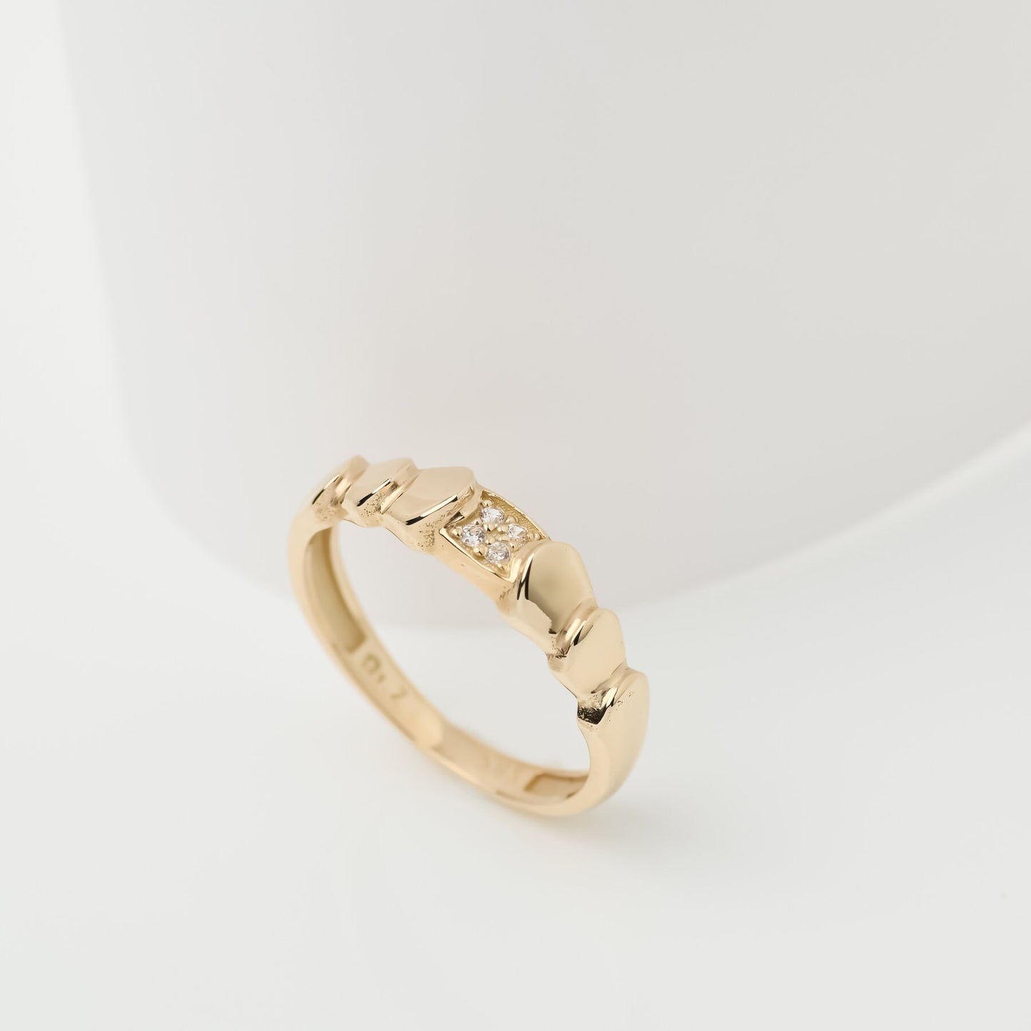 Handmade wrapped ring in 14k solid gold, the top part of the ring is encrusted with white cubic zirconia stones.