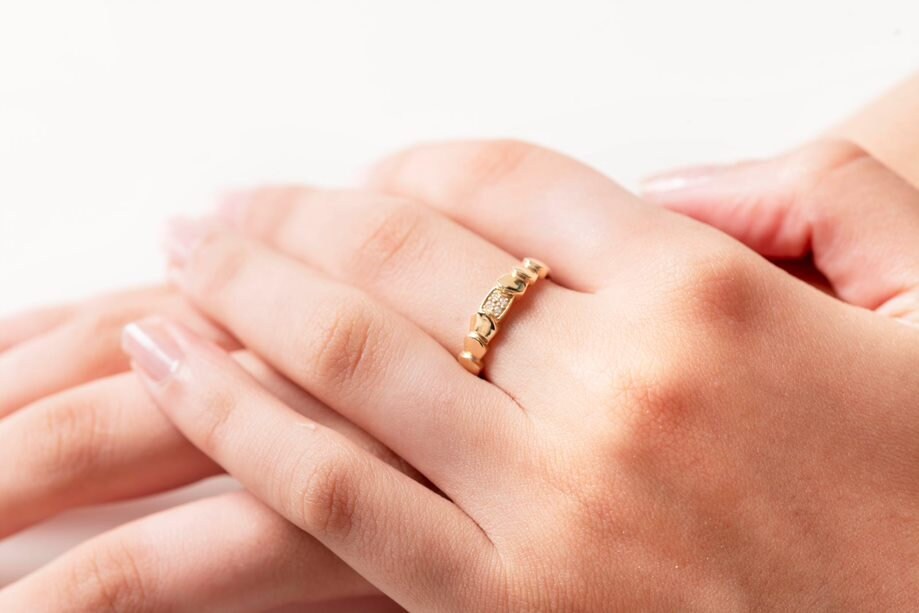 Handmade wrapped ring in 14k solid gold, the top part of the ring is encrusted with white cubic zirconia stones.