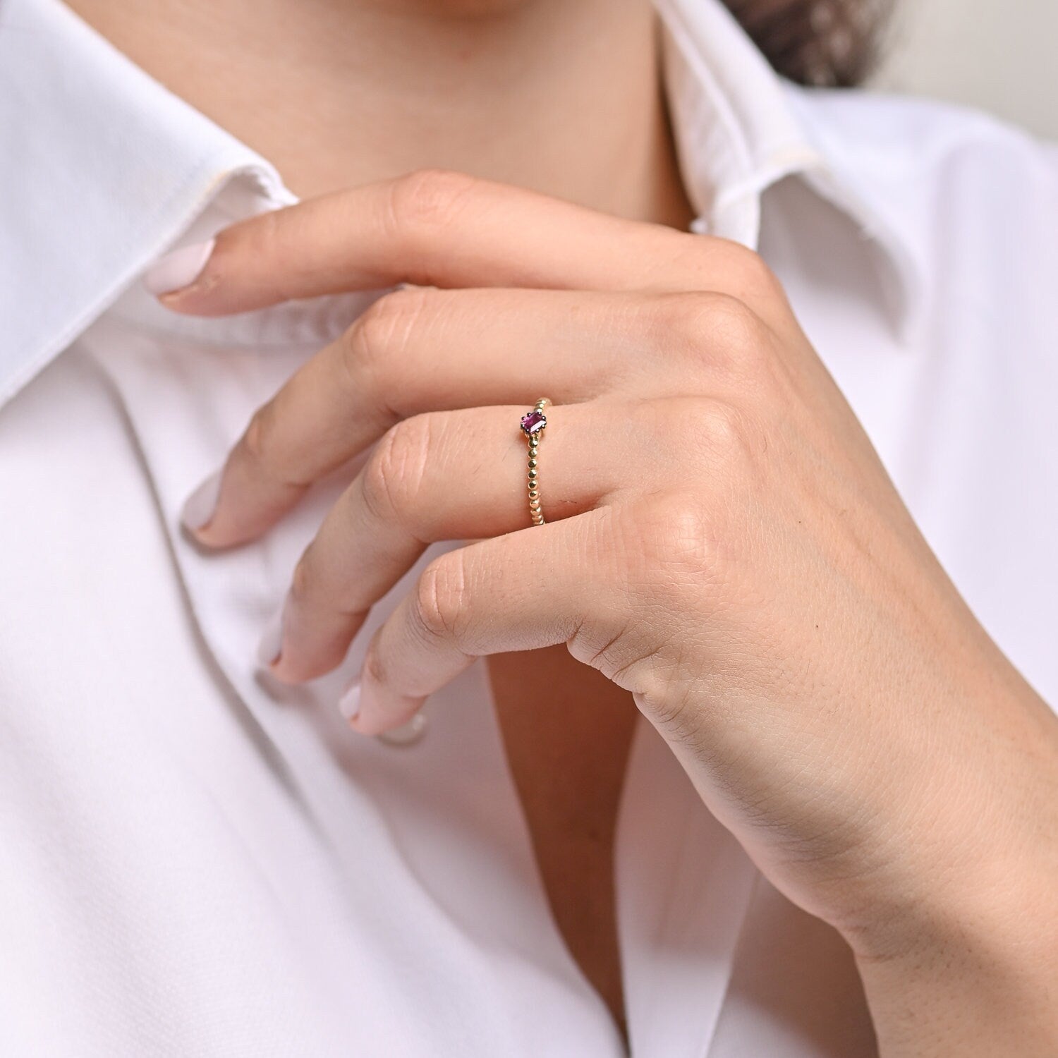 A women's Ruby Solitaire Ring, crafted in 14k gold with a beaded design.