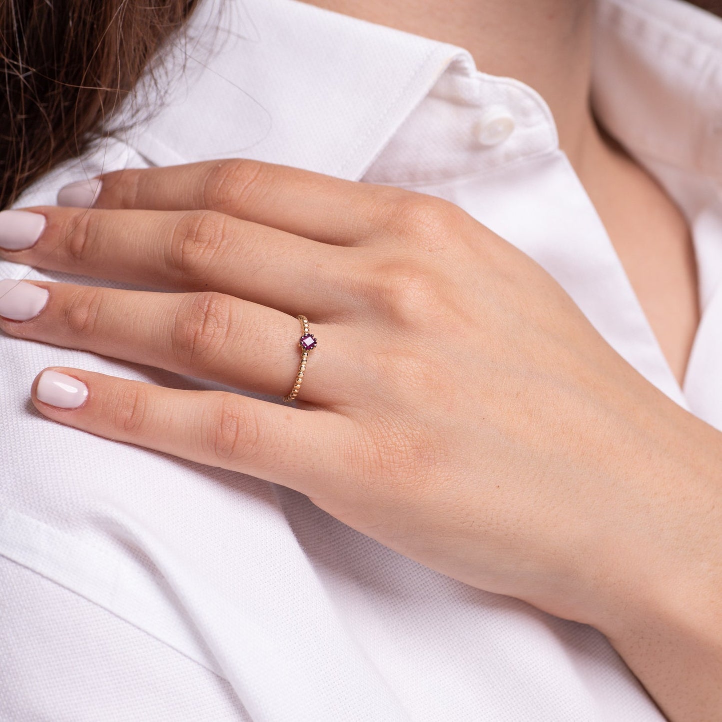 A women's Ruby Solitaire Ring, crafted in 14k gold with a beaded design.