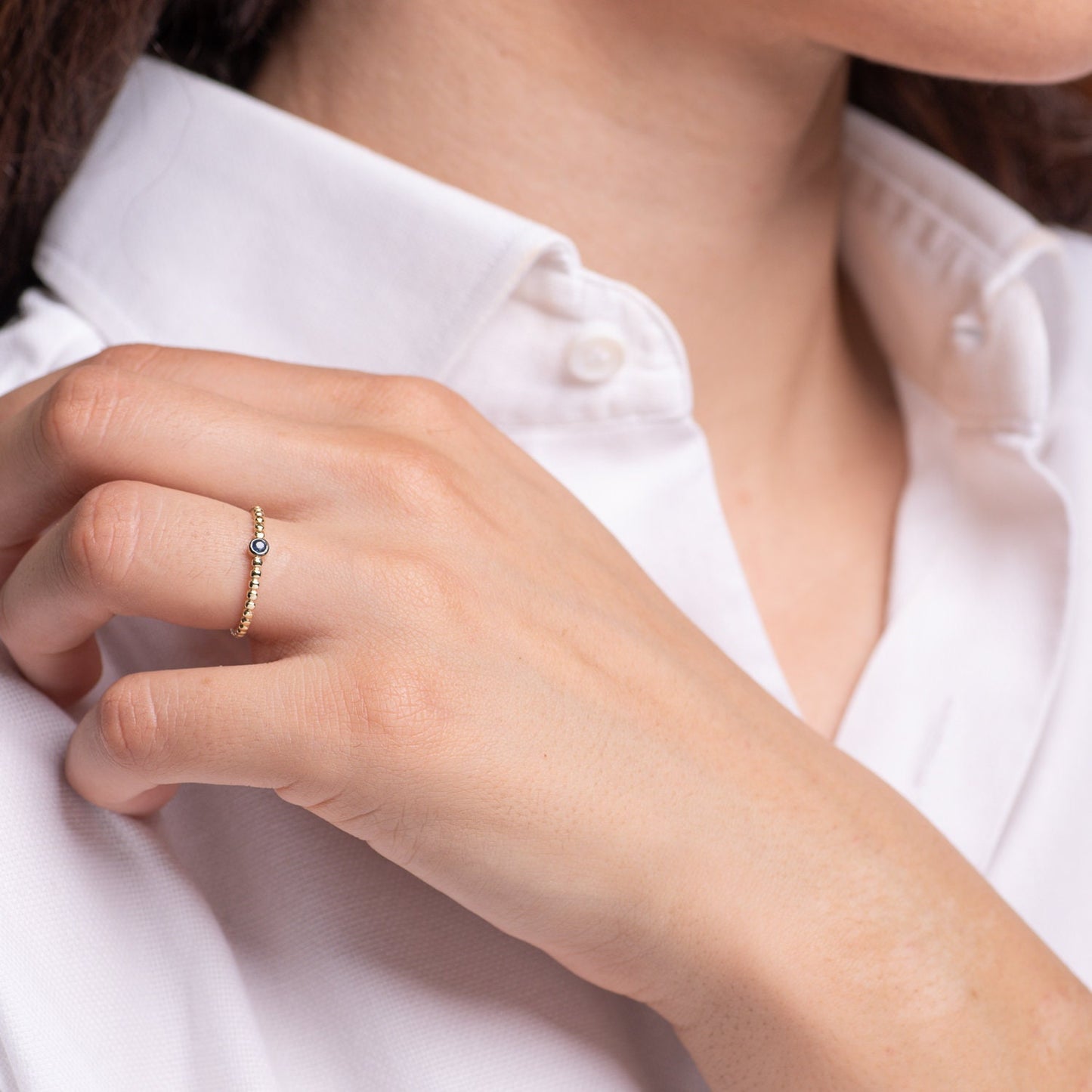 Handmade beaded ring featuring a single birthstone in a bezel setting.