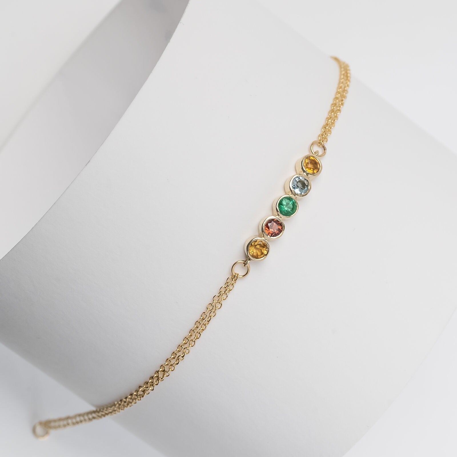 Family birthstone bracelet with five stones, crafted in 14k gold with a double chain for women.