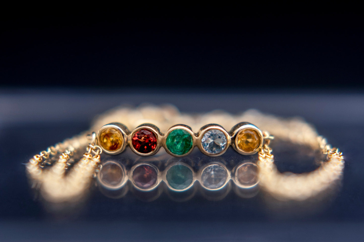 Family birthstone bracelet with five stones, crafted in 14k gold with a double chain for women.