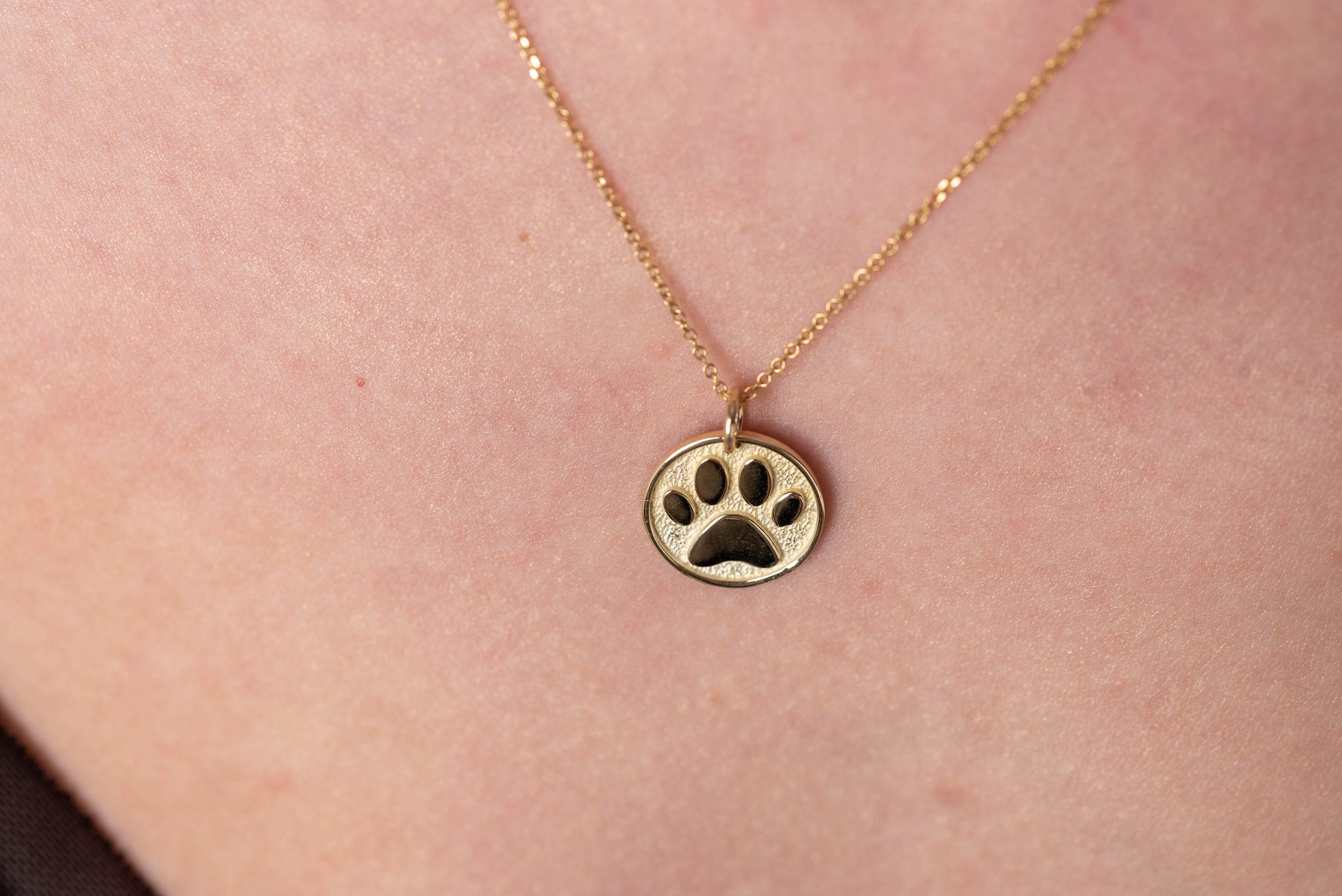 Paw Pendant crafted in 14k solid gold, complete with complimentary engraving on the reverse side.