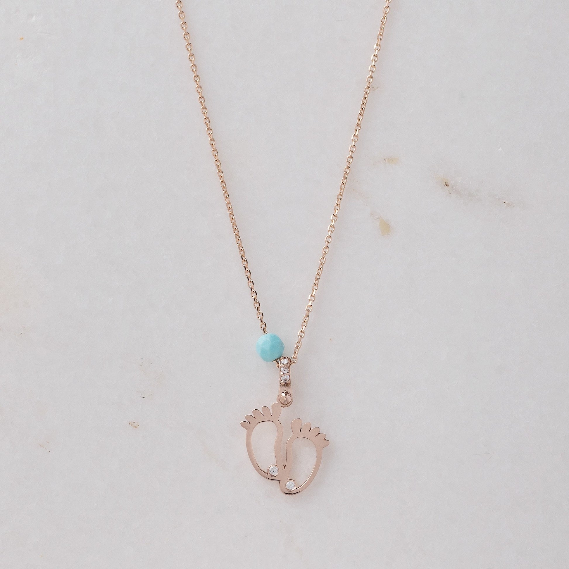 baby footprint necklace in 14k gold with cubic zirconia and turquoise stone 