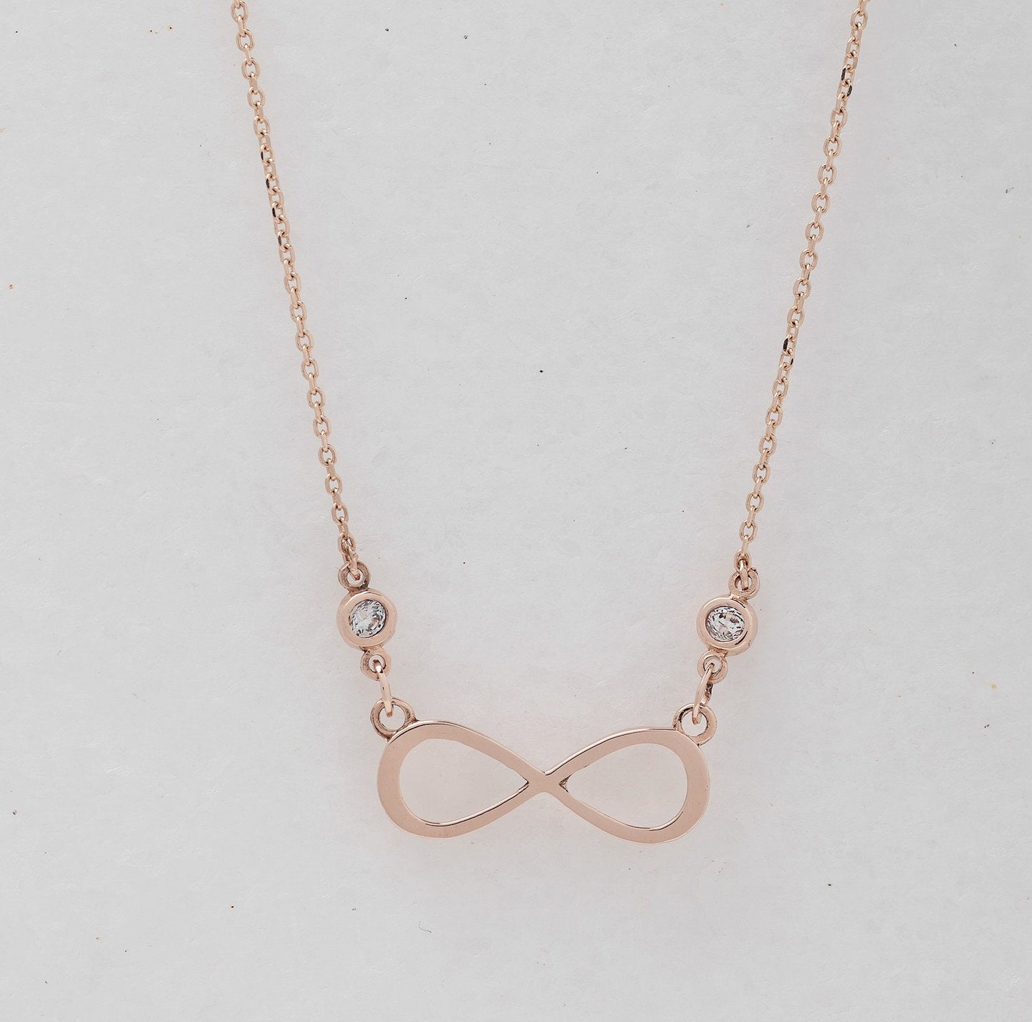 Rose Gold Infinity Necklace with Two Cubic Zirconia Stones