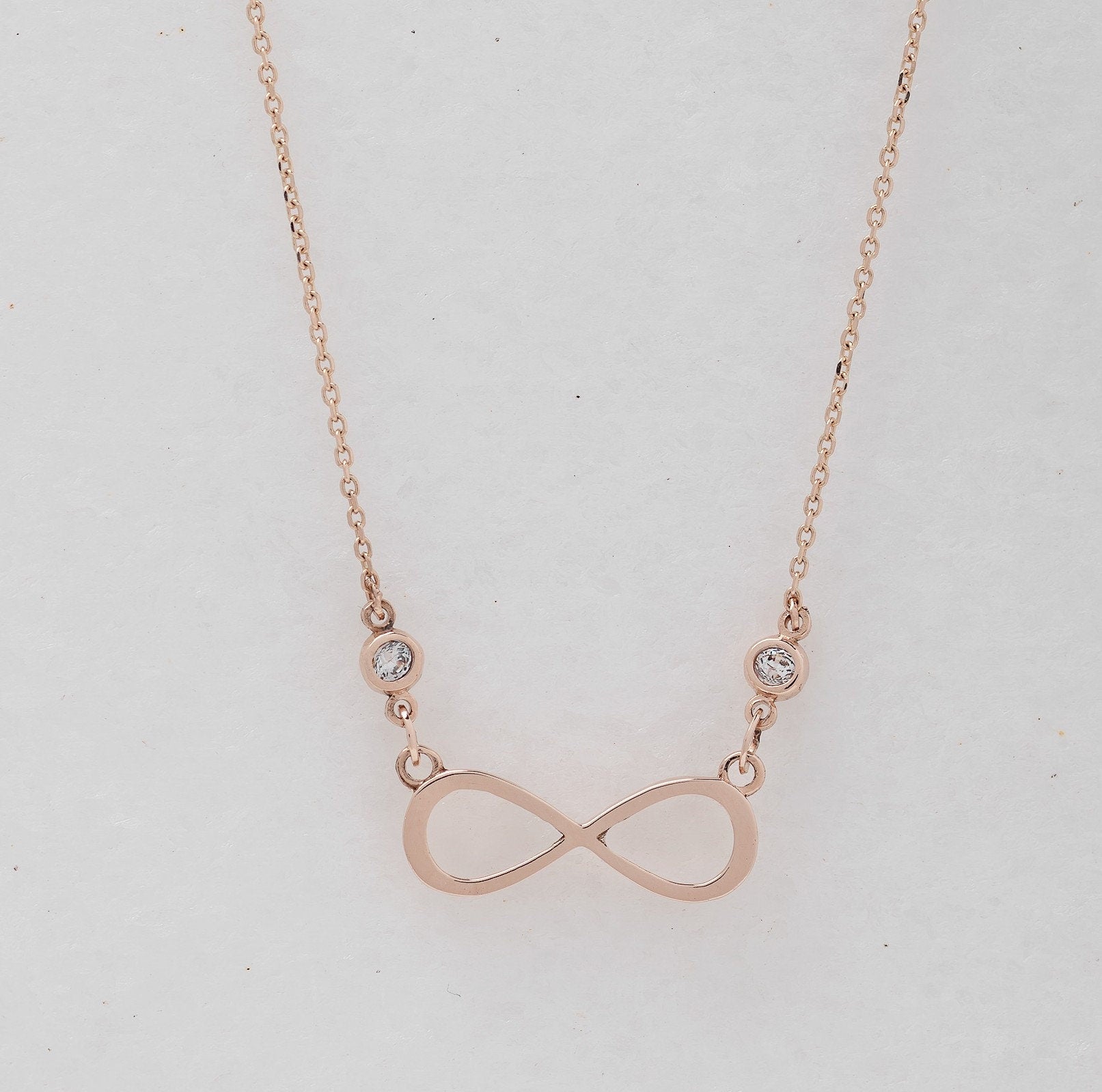 Rose Gold Infinity Necklace with Two Cubic Zirconia Stones