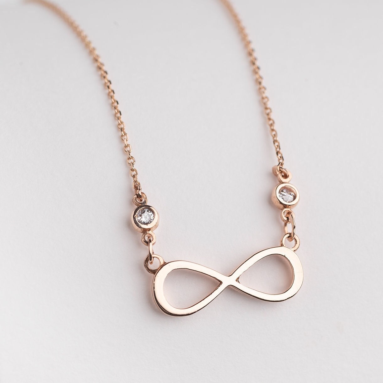 Rose Gold Infinity Necklace with Two Cubic Zirconia Stones