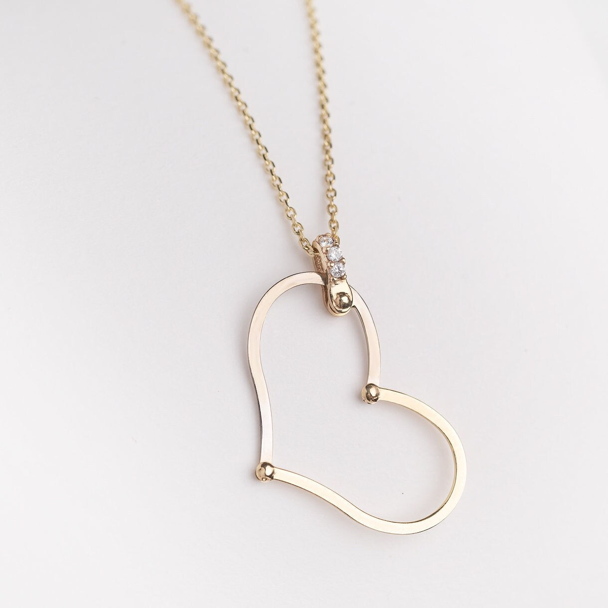 Large Heart Necklace in 14k solid gold with cubic zirconia stones on the loop