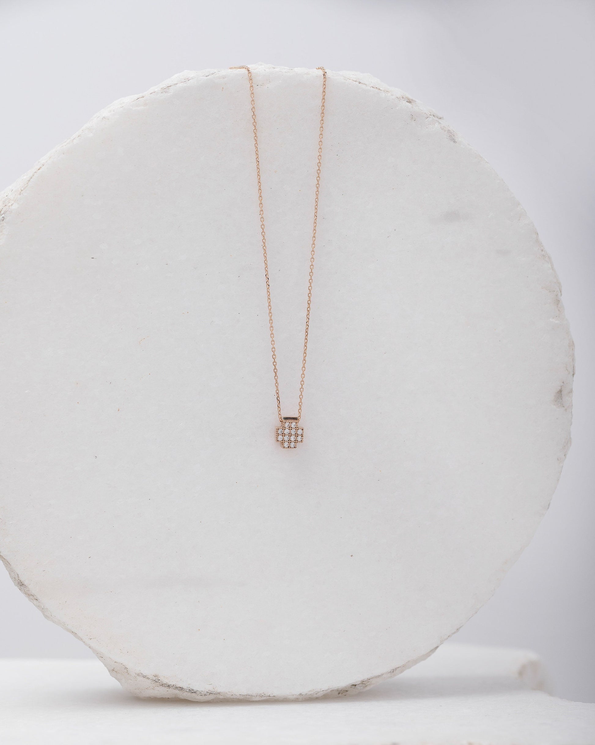 square cross necklace in 14k gold paved with white cubic zirconia stones for women 