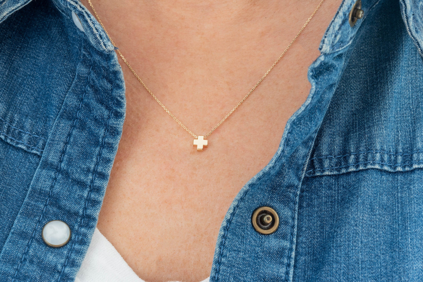 square small necklace in 14k yellow gold worn by a model 