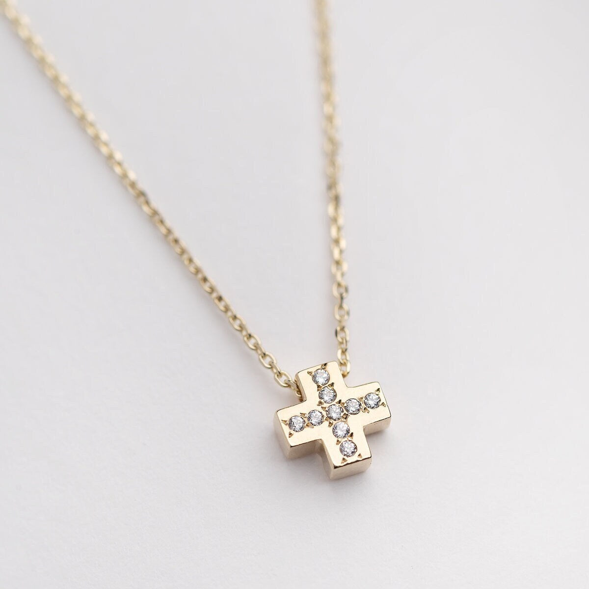 paved small cross necklace in 14k yellow gold for women