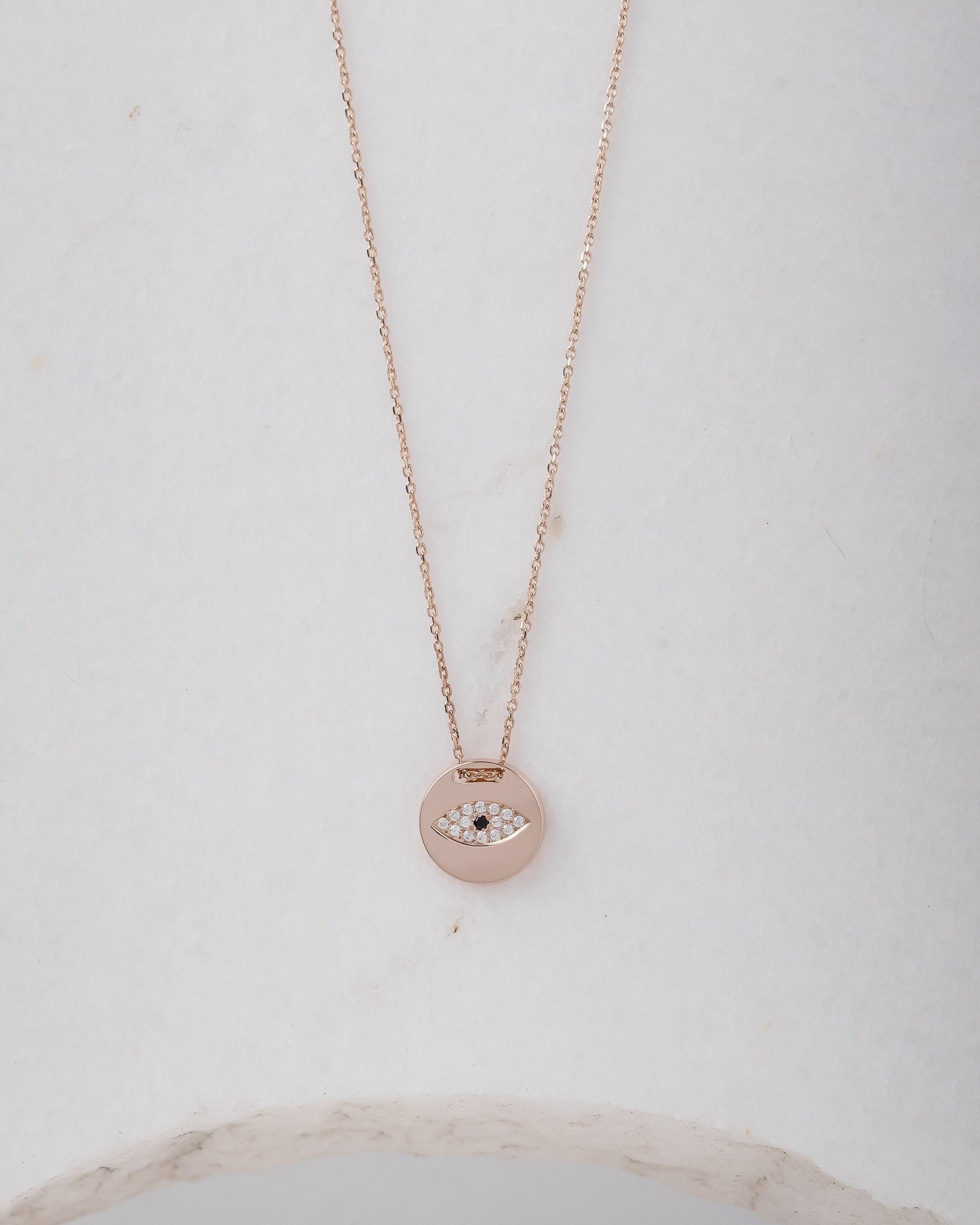 Pavé evil eye necklace in 14k yellow gold for women.